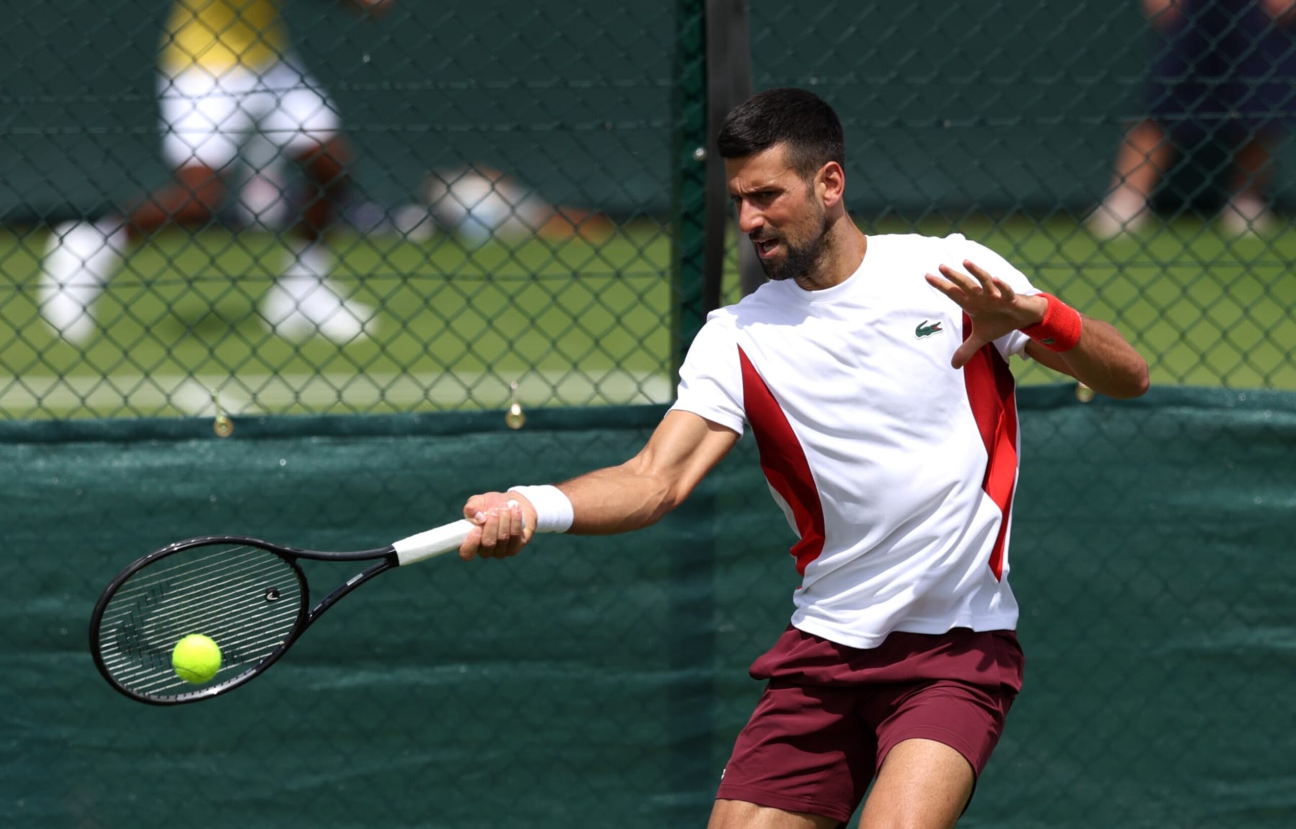 LONDON, ENGLAND - JUNE 27: Novak Djokovic of Serbia plays a forehand during practice prior to The Championships Wimbledon 2024 at All England Lawn Tennis and Croquet Club on June 27, 2024 in London, England. (Photo by Clive Brunskill/Getty Images)