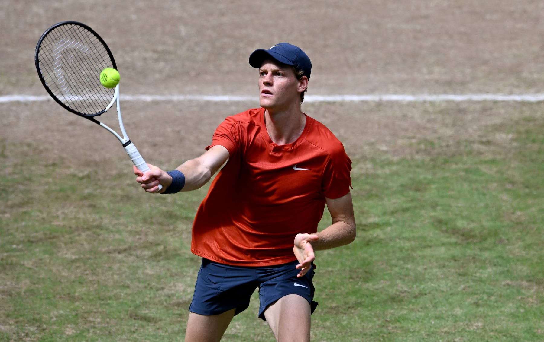 Italy's Jannik Sinner returns the ball to Poland's Hubert Hurkacz during the men's singles final tennis match of the ATP 500 Halle Open tennis tournament in Halle, western Germany on June 23, 2024. (Photo by CARMEN JASPERSEN / AFP) (Photo by CARMEN JASPERSEN/AFP via Getty Images)