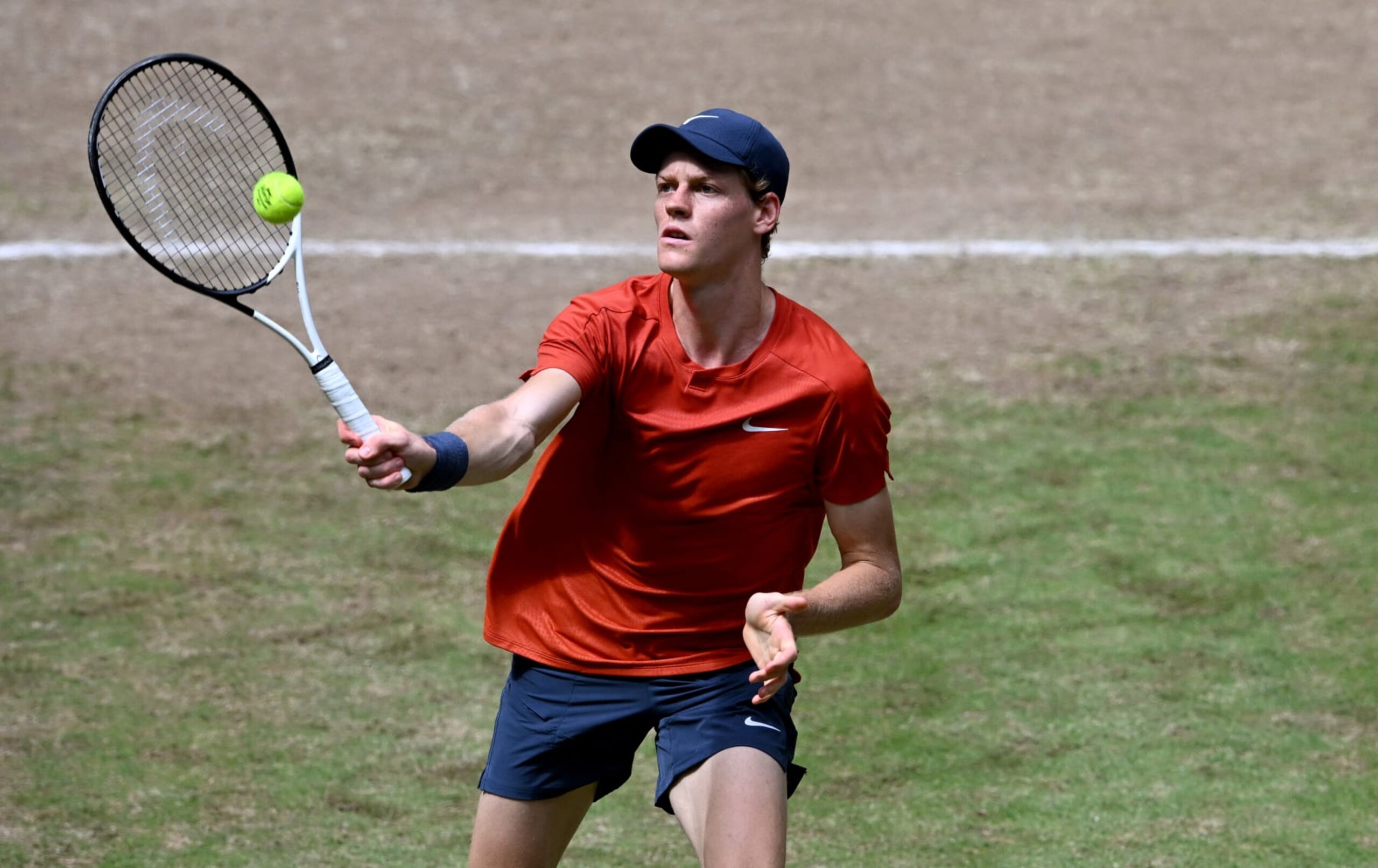 Italy's Jannik Sinner returns the ball to Poland's Hubert Hurkacz during the men's singles final tennis match of the ATP 500 Halle Open tennis tournament in Halle, western Germany on June 23, 2024. (Photo by CARMEN JASPERSEN / AFP) (Photo by CARMEN JASPERSEN/AFP via Getty Images)