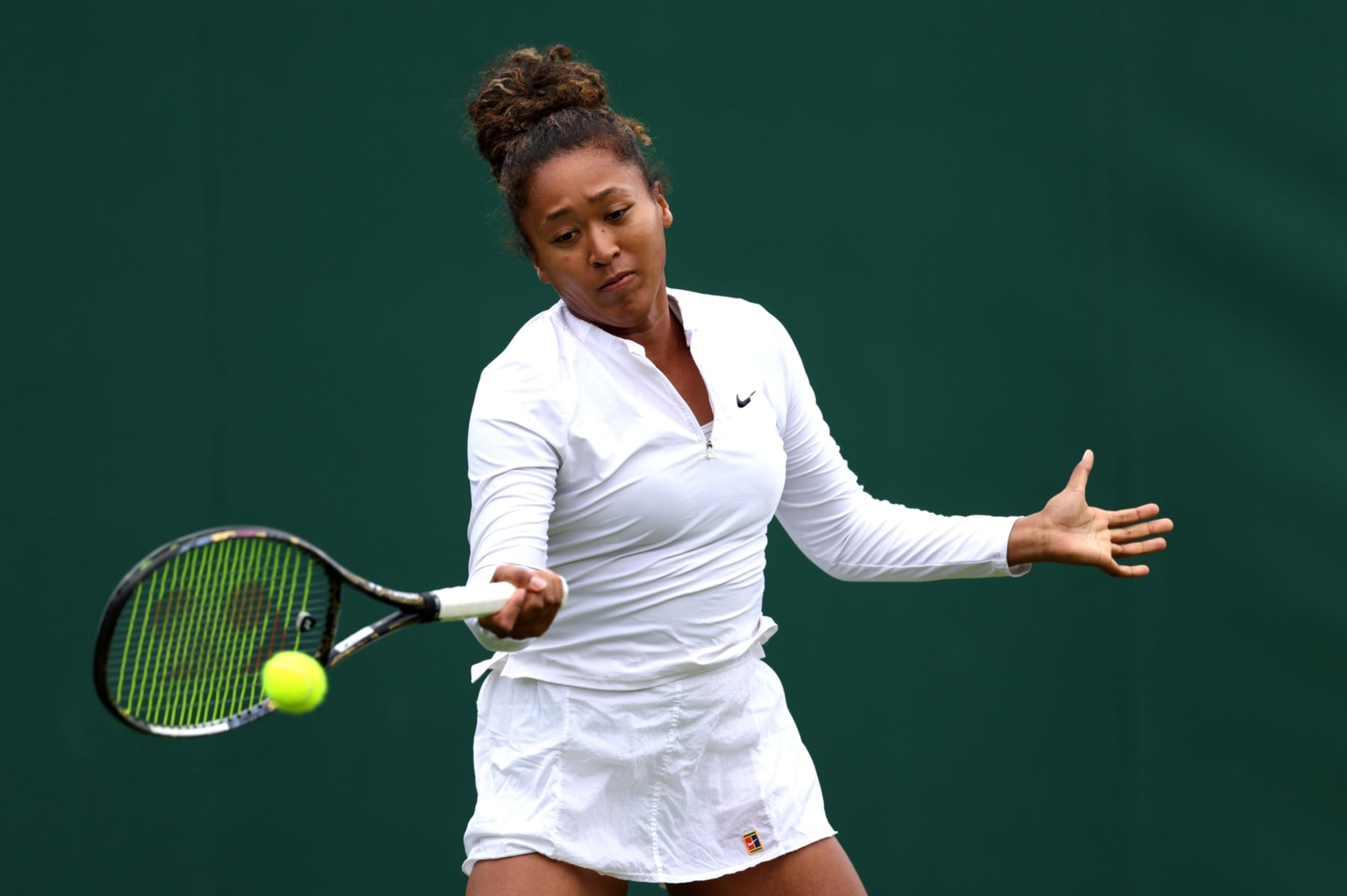 LONDON, ENGLAND - JUNE 28: Naomi Osaka of Japan plays a forehand during practice prior to The Championships Wimbledon 2024 at All England Lawn Tennis and Croquet Club on June 28, 2024 in London, England. (Photo by Clive Brunskill/Getty Images)