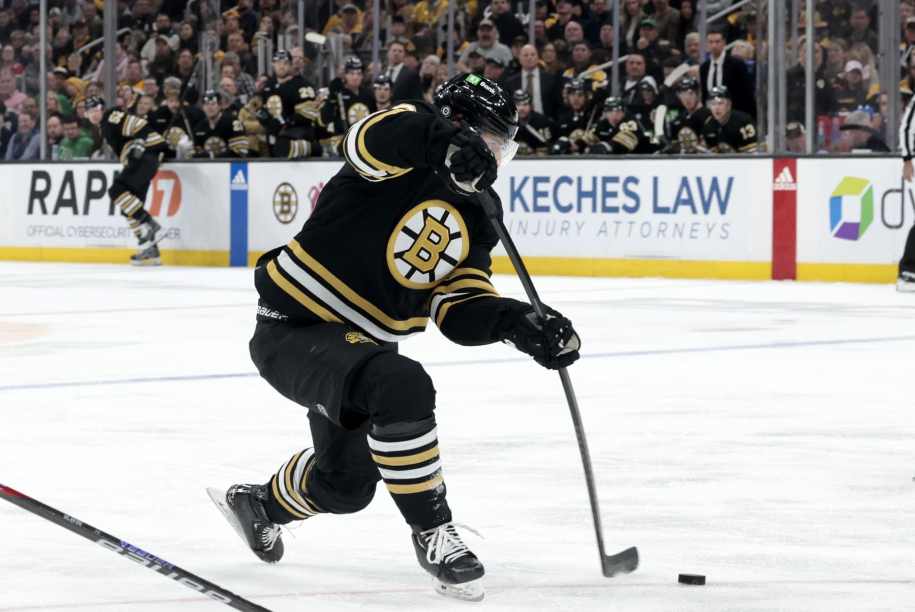 BOSTON, MA - APRIL 09: Boston Bruins winger Jakub Lauko (94) shoots during a game between the Boston Bruins and the Carolina Hurricanes on April 9, 2024, at TD Garden in Boston, Massachusetts. (Photo by Fred Kfoury III/Icon Sportswire via Getty Images)