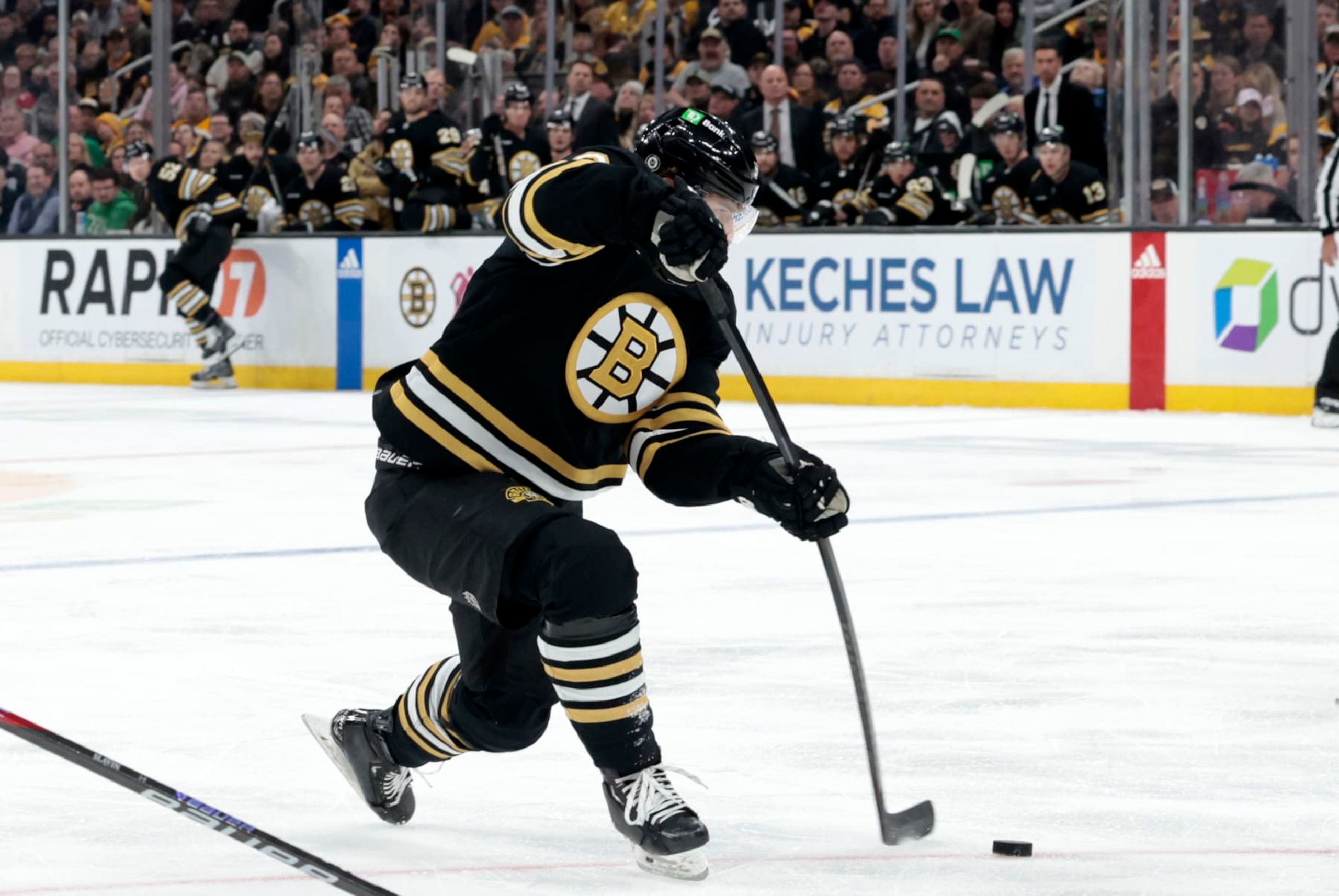 BOSTON, MA - APRIL 09: Boston Bruins winger Jakub Lauko (94) shoots during a game between the Boston Bruins and the Carolina Hurricanes on April 9, 2024, at TD Garden in Boston, Massachusetts. (Photo by Fred Kfoury III/Icon Sportswire via Getty Images)