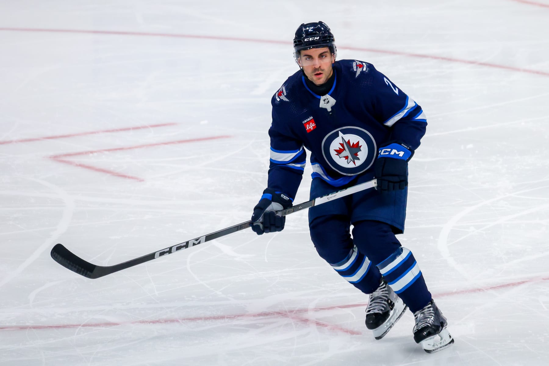 WINNIPEG, CANADA - APRIL 23: Dylan DeMelo #2 of the Winnipeg Jets skates during third period action against the Colorado Avalanche in Game Two of the First Round of the 2024 Stanley Cup Playoffs at Canada Life Centre on April 23, 2024 in Winnipeg, Manitoba, Canada. (Photo by Jonathan Kozub/NHLI via Getty Images)
