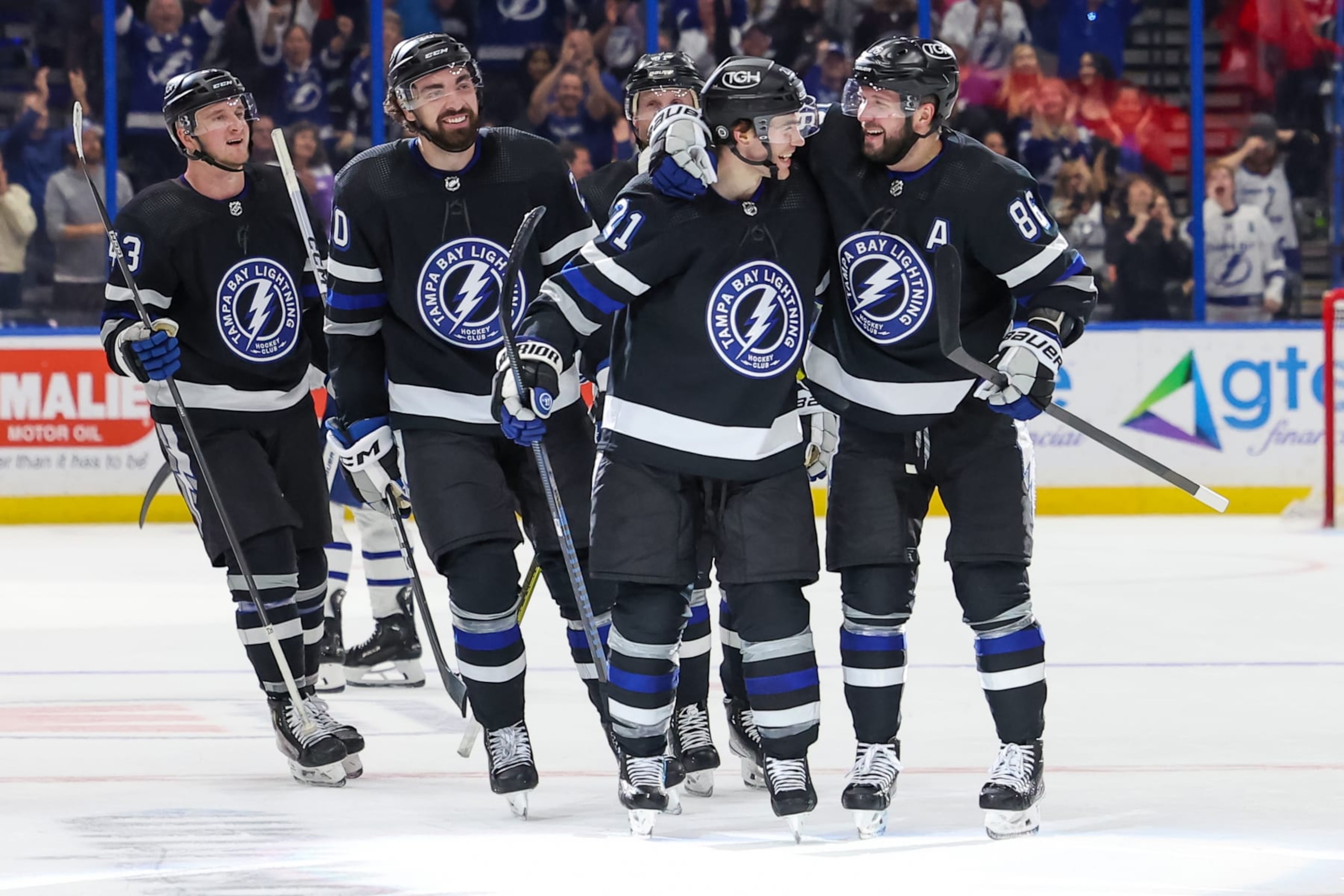 TAMPA, FL - APRIL 17: Nikita Kucherov #86 of the Tampa Bay Lightning, right, celebrates his 100th assist on the season with Brayden Point #21 against the Toronto Maple Leafs during the second period at the Amalie Arena on April 17, 2024 in Tampa, Florida. (Photo by Mike Carlson/Getty Images)