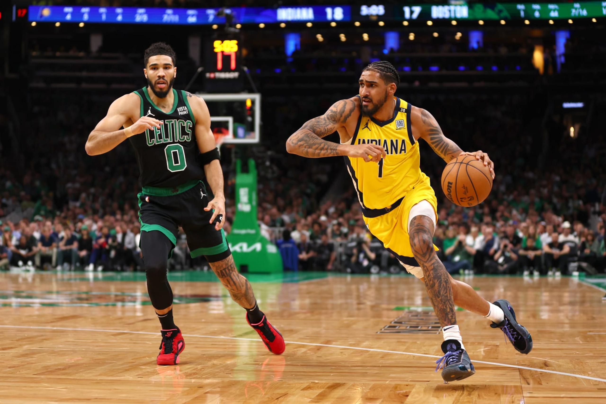 BOSTON, MASSACHUSETTS - MAY 23: Obi Toppin #1 of the Indiana Pacers drives past Jayson Tatum #0 of the Boston Celtics during the first quarter in Game Two of the Eastern Conference Finals at TD Garden on May 23, 2024 in Boston, Massachusetts. NOTE TO USER: User expressly acknowledges and agrees that, by downloading and or using this photograph, User is consenting to the terms and conditions of the Getty Images License Agreement. (Photo by Maddie Meyer/Getty Images) BOSTON, MASSACHUSETTS - MAY 23: Obi Toppin #1 of the Indiana Pacers drives past Jayson Tatum #0 of the Boston Celtics during the first quarter in Game Two of the Eastern Conference Finals at TD Garden on May 23, 2024 in Boston, Massachusetts. NOTE TO USER: User expressly acknowledges and agrees that, by downloading and or using this photograph, User is consenting to the terms and conditions of the Getty Images License Agreement. (Photo by Maddie Meyer/Getty Images)