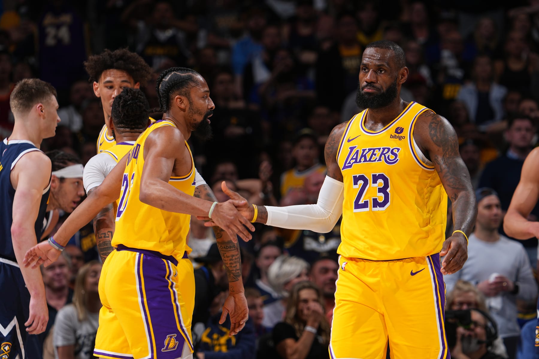 DENVER, CO - APRIL 29: Spencer Dinwiddie #26 of the Los Angeles Lakers and LeBron James #23 of the Los Angeles Lakers high five during the game against the Denver Nuggets during Round One Game Five of the 2024 NBA Playoffs on April 29, 2024 at the Ball Arena in Denver, Colorado. NOTE TO USER: User expressly acknowledges and agrees that, by downloading and/or using this Photograph, user is consenting to the terms and conditions of the Getty Images License Agreement. Mandatory Copyright Notice: Copyright 2024 NBAE (Photo by Bart Young/NBAE via Getty Images)