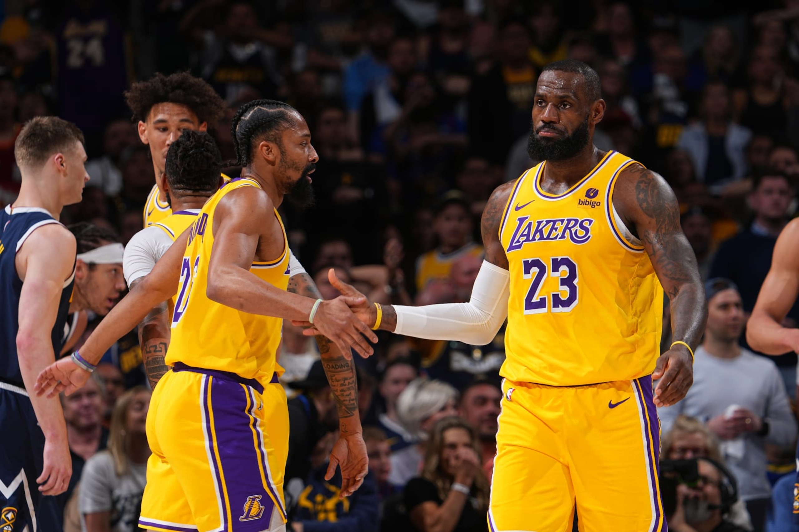 DENVER, CO - APRIL 29: Spencer Dinwiddie #26 of the Los Angeles Lakers and LeBron James #23 of the Los Angeles Lakers high five during the game against the Denver Nuggets during Round One Game Five of the 2024 NBA Playoffs on April 29, 2024 at the Ball Arena in Denver, Colorado. NOTE TO USER: User expressly acknowledges and agrees that, by downloading and/or using this Photograph, user is consenting to the terms and conditions of the Getty Images License Agreement. Mandatory Copyright Notice: Copyright 2024 NBAE (Photo by Bart Young/NBAE via Getty Images) DENVER, CO - APRIL 29: Spencer Dinwiddie #26 of the Los Angeles Lakers and LeBron James #23 of the Los Angeles Lakers high five during the game against the Denver Nuggets during Round One Game Five of the 2024 NBA Playoffs on April 29, 2024 at the Ball Arena in Denver, Colorado. NOTE TO USER: User expressly acknowledges and agrees that, by downloading and/or using this Photograph, user is consenting to the terms and conditions of the Getty Images License Agreement. Mandatory Copyright Notice: Copyright 2024 NBAE (Photo by Bart Young/NBAE via Getty Images)