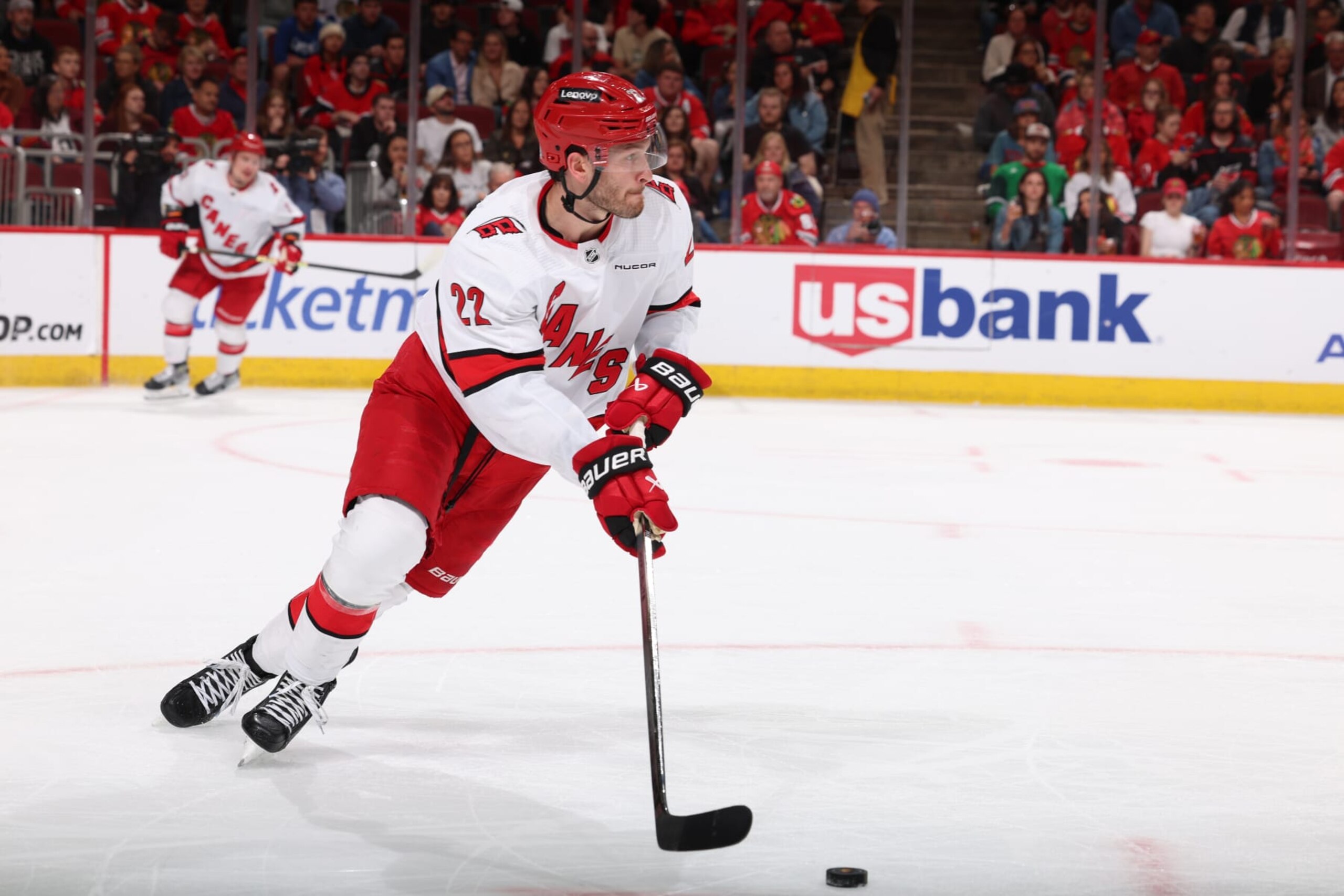 CHICAGO, ILLINOIS - APRIL 14: Brett Pesce #22 of the Carolina Hurricanes looks to take the puck up the ice in the second period \abh at the United Center on April 14, 2024 in Chicago, Illinois. (Photo by Chase Agnello-Dean/NHLI via Getty Images)