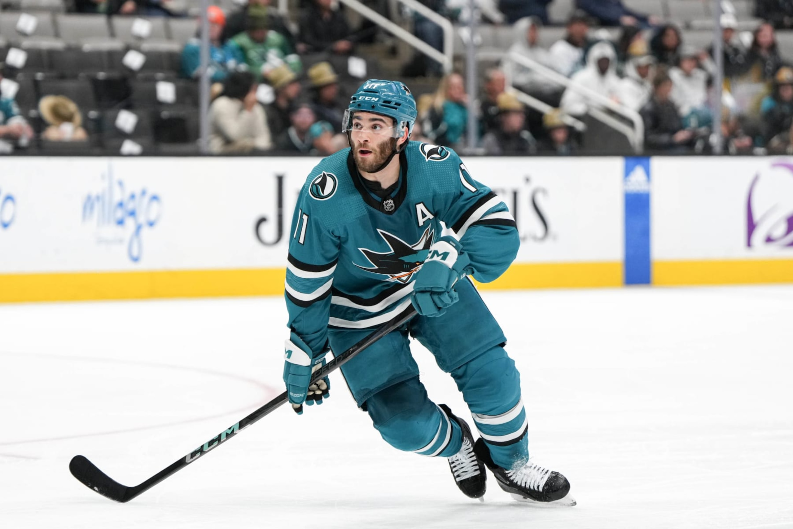 SAN JOSE, CALIFORNIA - APRIL 6: Luke Kunin #11 of the San Jose Sharks skating with the puck in the first period against the St. Louis Blues at SAP Center on April 6, 2024 in San Jose, California. (Photo by Andreea Cardani/NHLI via Getty Images)