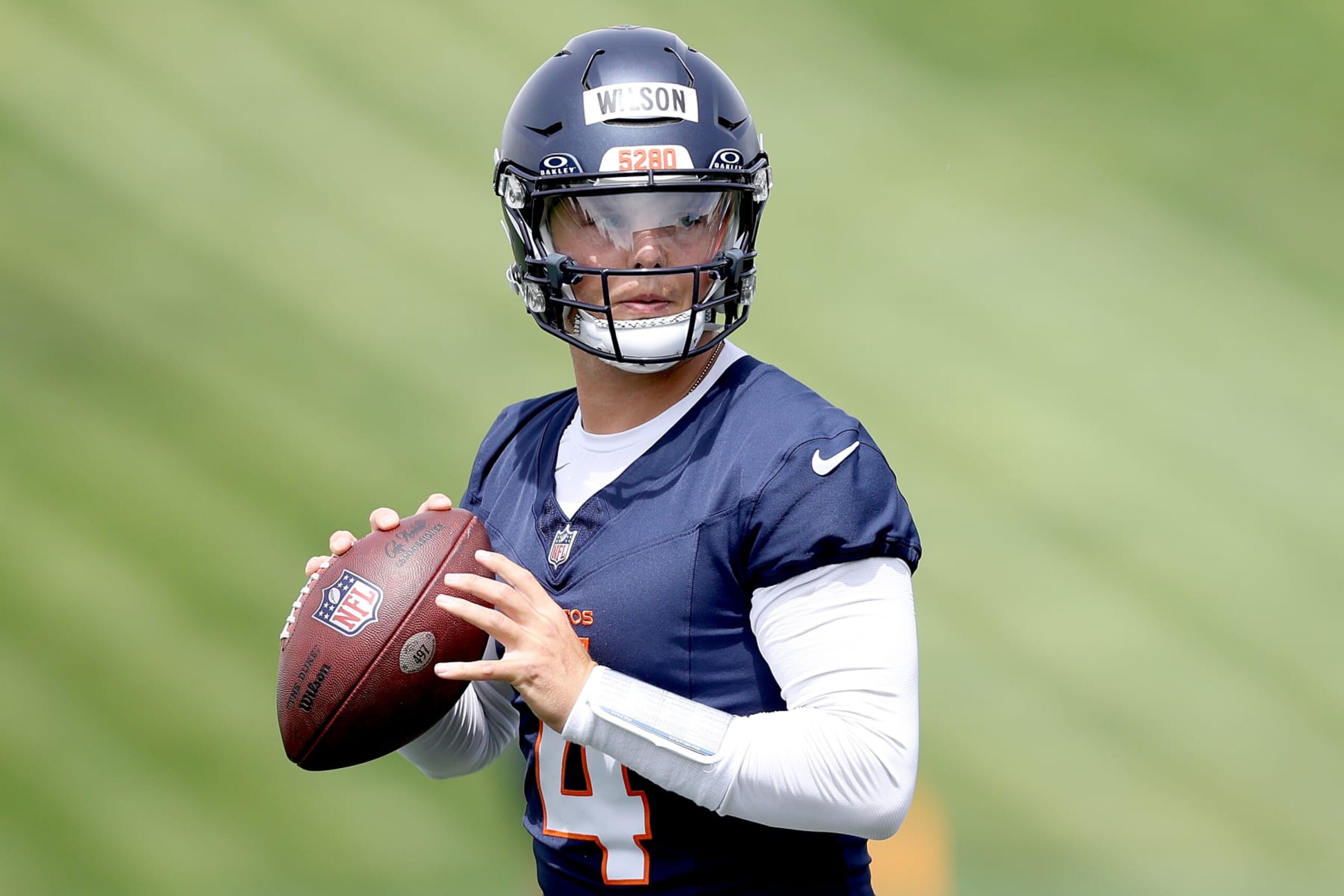 ENGLEWOOD, COLORADO - JUNE 04: Quarterback Zach Wilson #4 of the Denver Broncos throws during Denver Broncos OTA Offseason Workouts at Centura Health Training Center on June 04, 2024 in Englewood, Colorado. (Photo by Matthew Stockman/Getty Images)