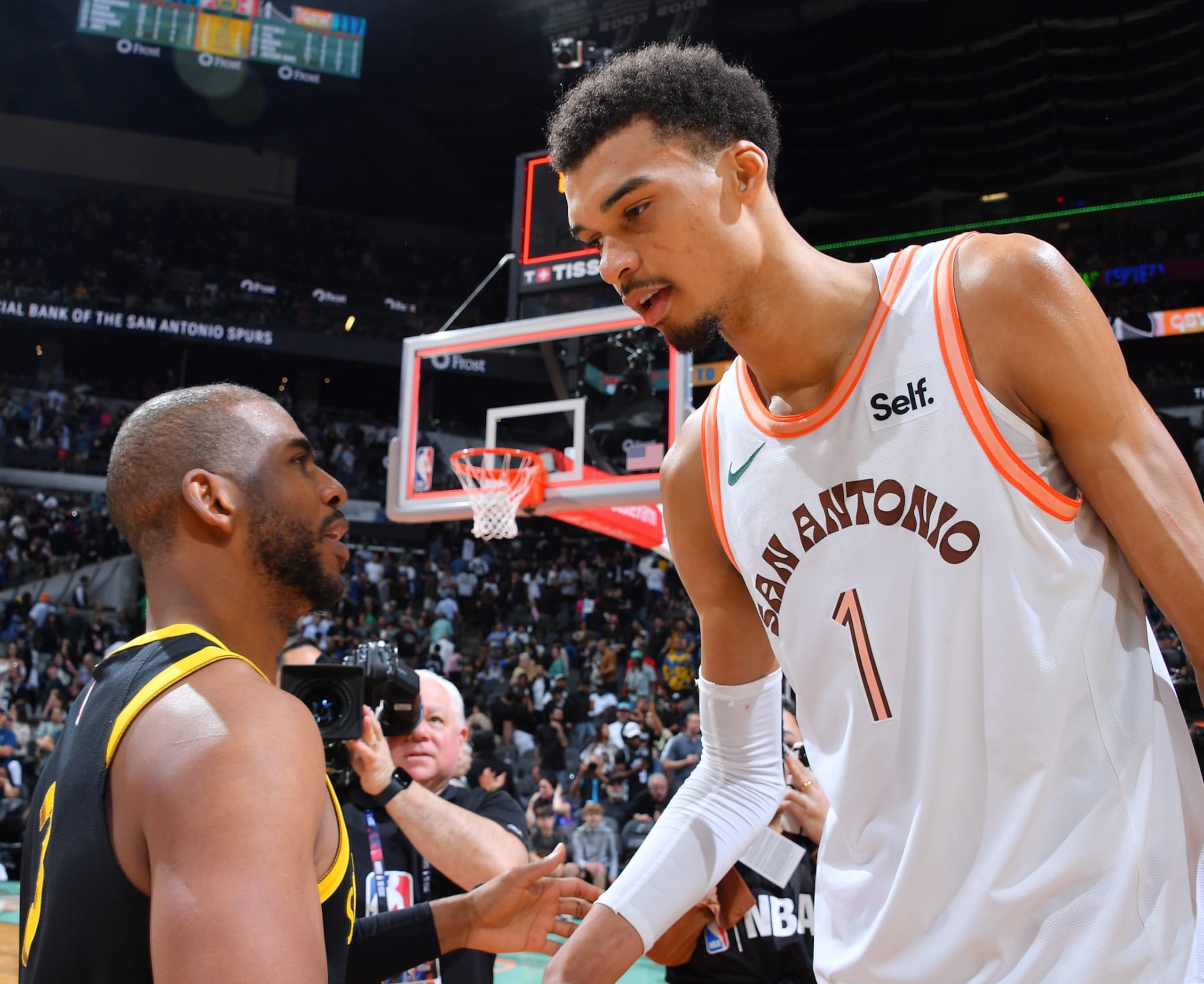 SAN ANTONIO, TX - MARCH 31: Chris Paul #3 of the Golden State Warriors and Victor Wembanyama #1 of the San Antonio Spurs talk after the game on March 31, 2024 at the Frost Bank Center in San Antonio, Texas. NOTE TO USER: User expressly acknowledges and agrees that, by downloading and or using this photograph, user is consenting to the terms and conditions of the Getty Images License Agreement. Mandatory Copyright Notice: Copyright 2024 NBAE (Photos by Michael Gonzales/NBAE via Getty Images)