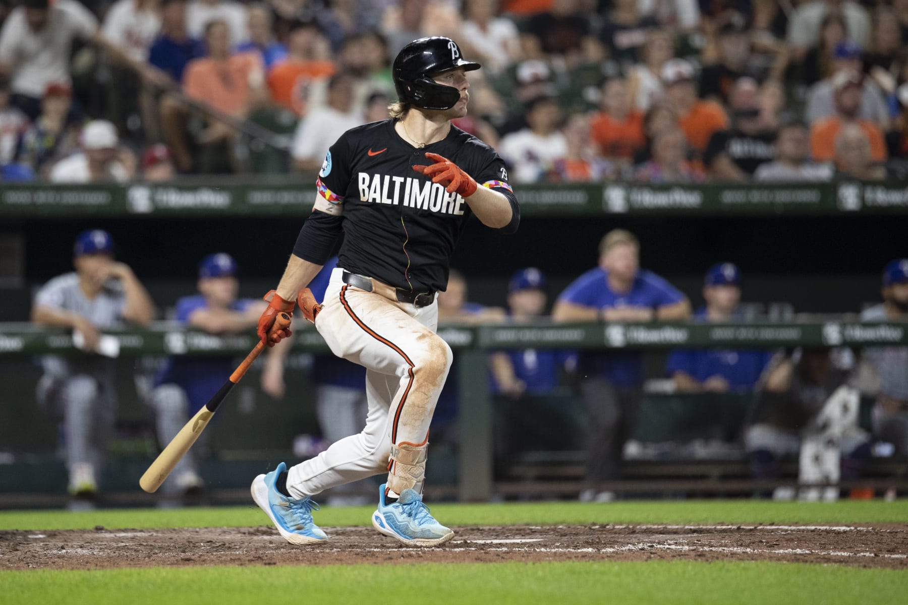 BALTIMORE, MD - JUNE 29: Baltimore Orioles shortstop Gunnar Henderson (2) gets a base hit during the Texas Rangers versus Baltimore Orioles MLB game at Orioles Park at Camden Yards on June 29, 2024, in Baltimore, MD. (Photo by Charles Brock/Icon Sportswire via Getty Images)