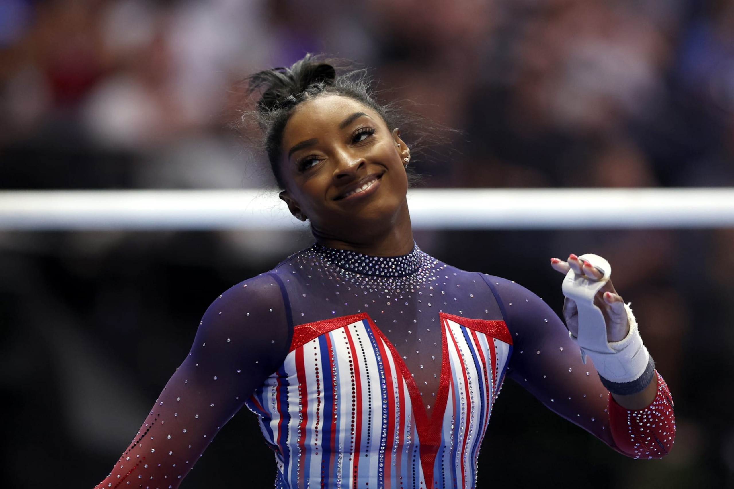 MINNEAPOLIS, MINNESOTA - JUNE 30: Simone Biles reacts after finishing her routine on the uneven bars on Day Four of the 2024 U.S. Olympic Team Gymnastics Trials at Target Center on June 30, 2024 in Minneapolis, Minnesota. (Photo by Jamie Squire/Getty Images)