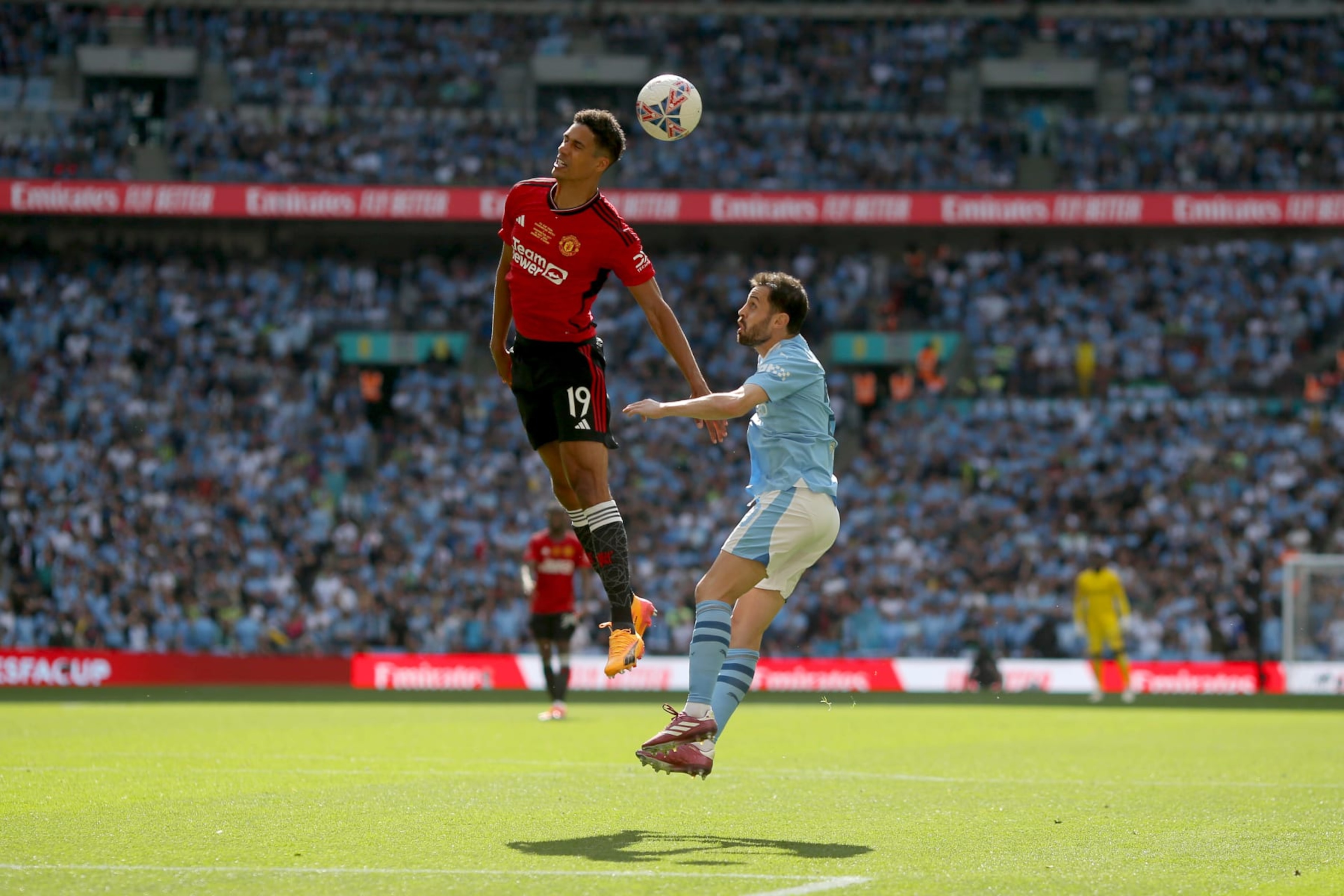 LONDON, ENGLAND - MAY 25: Raphael Varane of Manchester United heads away from Bernardo Silva of Manchester City during the Emirates FA Cup Final match between Manchester City and Manchester United at Wembley Stadium on May 25, 2024 in London, England. (Photo by Neal Simpson/Sportsphoto/Allstar via Getty Images) LONDON, ENGLAND - MAY 25: Raphael Varane of Manchester United heads away from Bernardo Silva of Manchester City during the Emirates FA Cup Final match between Manchester City and Manchester United at Wembley Stadium on May 25, 2024 in London, England. (Photo by Neal Simpson/Sportsphoto/Allstar via Getty Images)