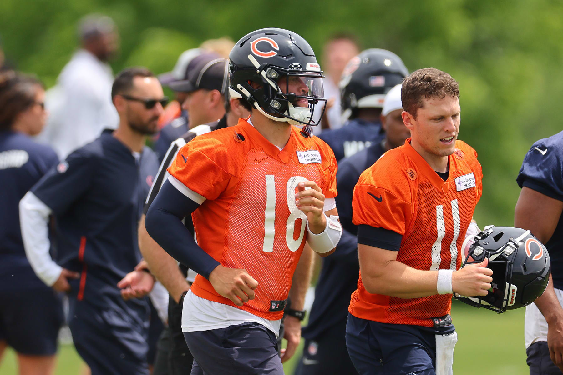LAKE FOREST, ILLINOIS - JUNE 04: Caleb Williams #18 of the Chicago Bears talks with Brett Rypien #11 during Chicago Bears Minicamp at Halas Hall on June 04, 2024 in Lake Forest, Illinois. (Photo by Michael Reaves/Getty Images)