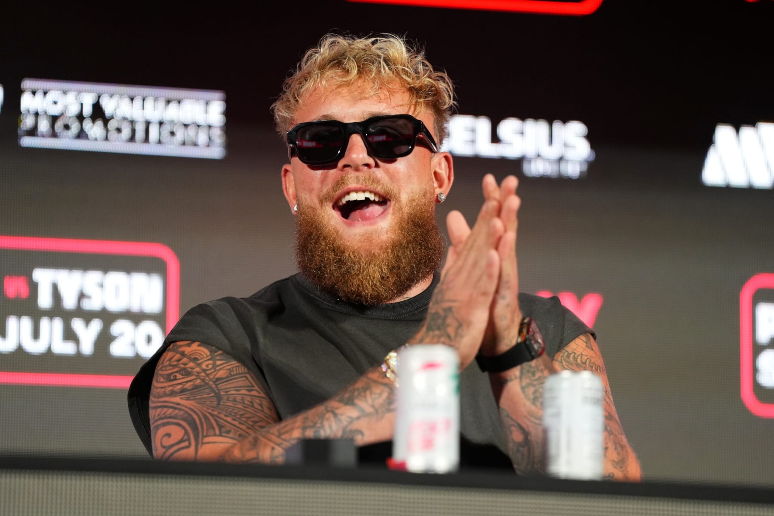 ARLINGTON, TEXAS - MAY 16: Jake Paul speaks onstage during the Jake Paul vs. Mike Tyson Boxing match Arlington press conference at Texas Live! on May 16, 2024 in Arlington, Texas.  (Photo by Cooper Neill/Getty Images for Netflix)
