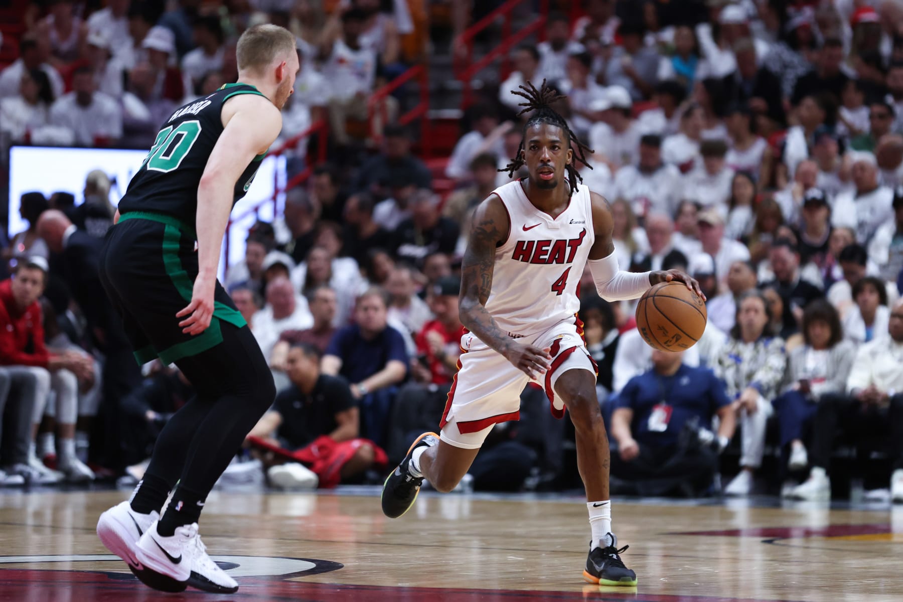 MIAMI, FLORIDA - APRIL 29: Delon Wright #4 of the Miami Heat dribbles the ball during the fourth quarter against the Boston Celtics in game four of the Eastern Conference First Round Playoffs at Kaseya Center on April 29, 2024 in Miami, Florida.  NOTE TO USER: User expressly acknowledges and agrees that, by downloading and or using this photograph, User is consenting to the terms and conditions of the Getty Images License Agreement. (Photo by Megan Briggs/Getty Images)