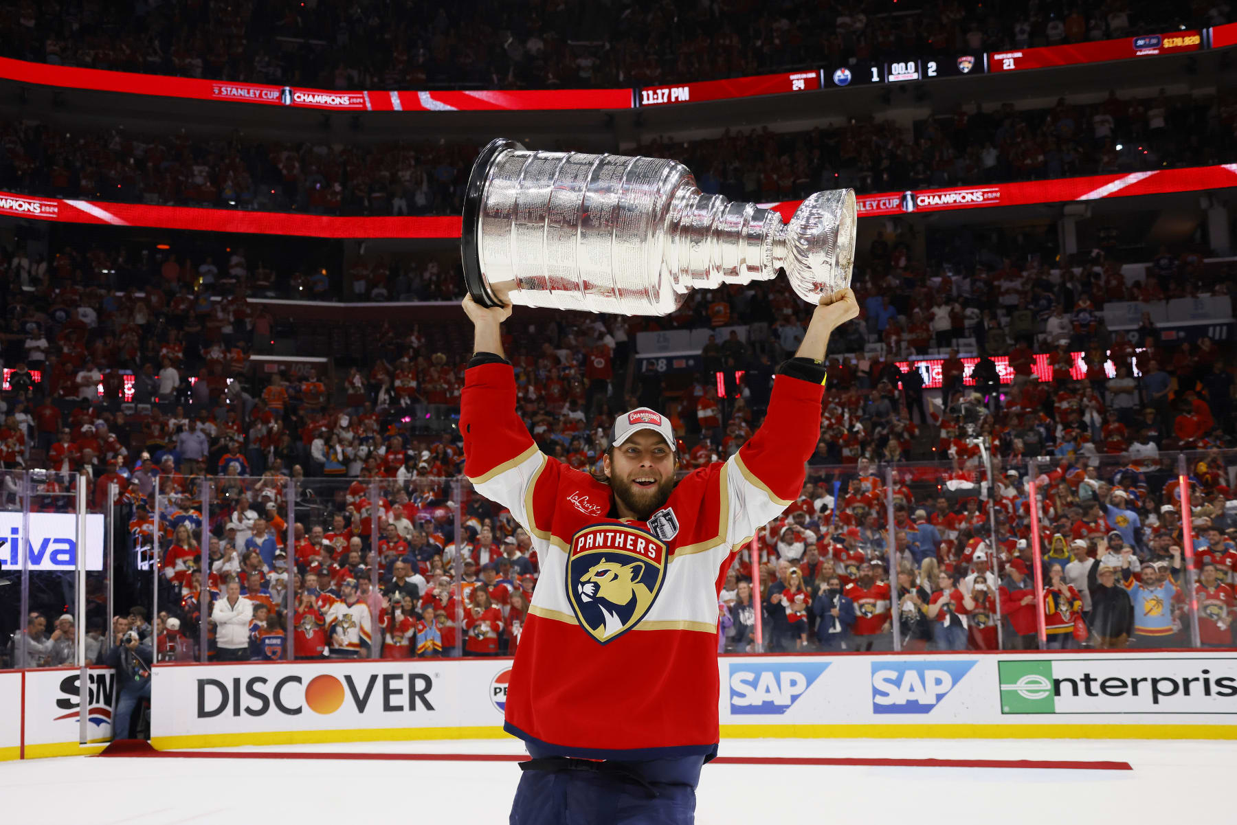 SUNRISE, FLORIDA - JUNE 24: Kevin Stenlund #82 of the Florida Panthers hoists the Stanley Cup after Florida's 2-1 victory against the Edmonton Oilers in Game Seven of the 2024 Stanley Cup Final at Amerant Bank Arena on June 24, 2024 in Sunrise, Florida. (Photo by Bruce Bennett/Getty Images)