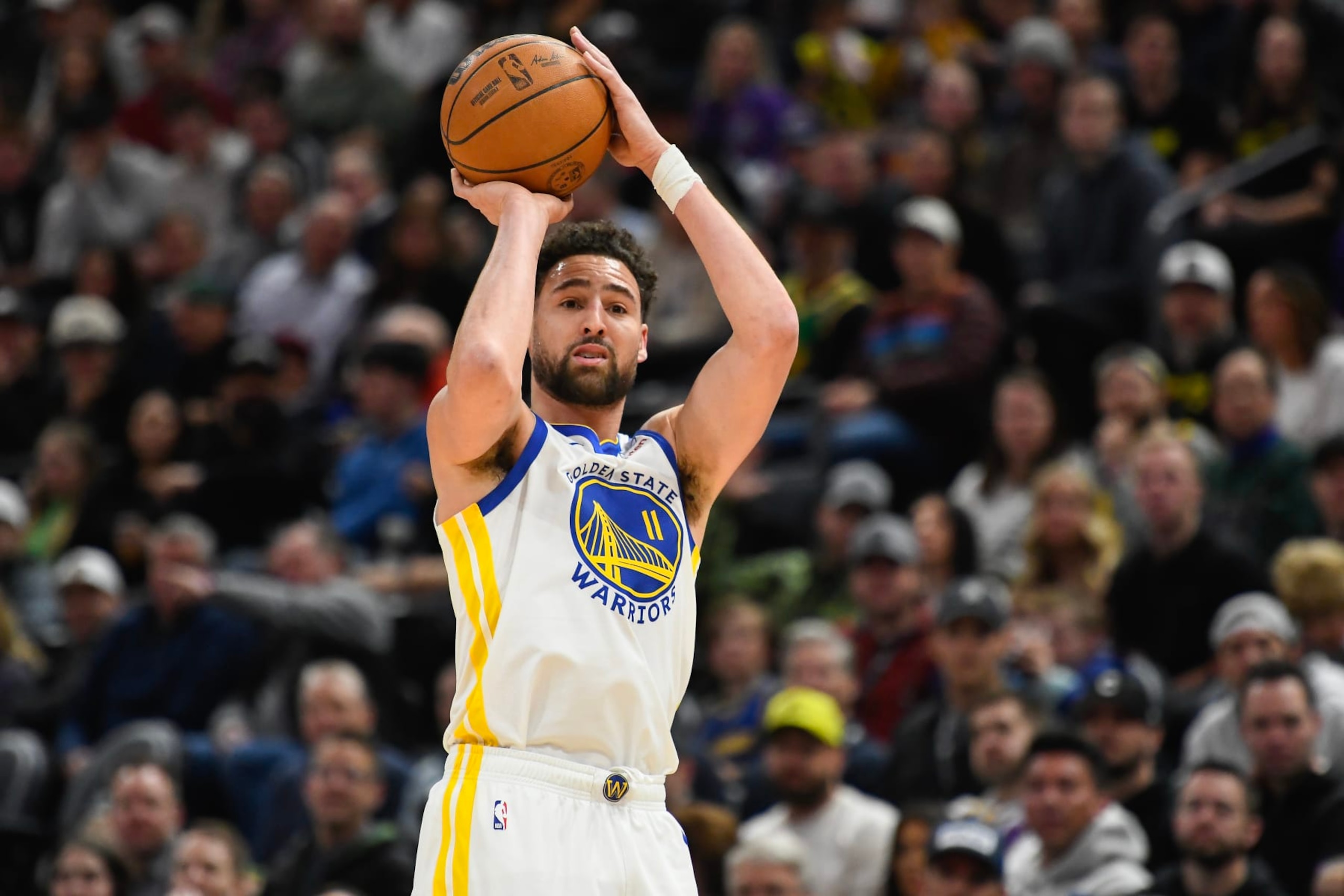 SALT LAKE CITY, UTAH - FEBRUARY 12: Klay Thompson #11 of the Golden State Warriors in action during the first half of a game against the Golden State Warriors at Delta Center on February 12, 2024 in Salt Lake City, Utah. NOTE TO USER: User expressly acknowledges and agrees that, by downloading and or using this photograph, User is consenting to the terms and conditions of the Getty Images License Agreement.  (Photo by Alex Goodlett/Getty Images)
