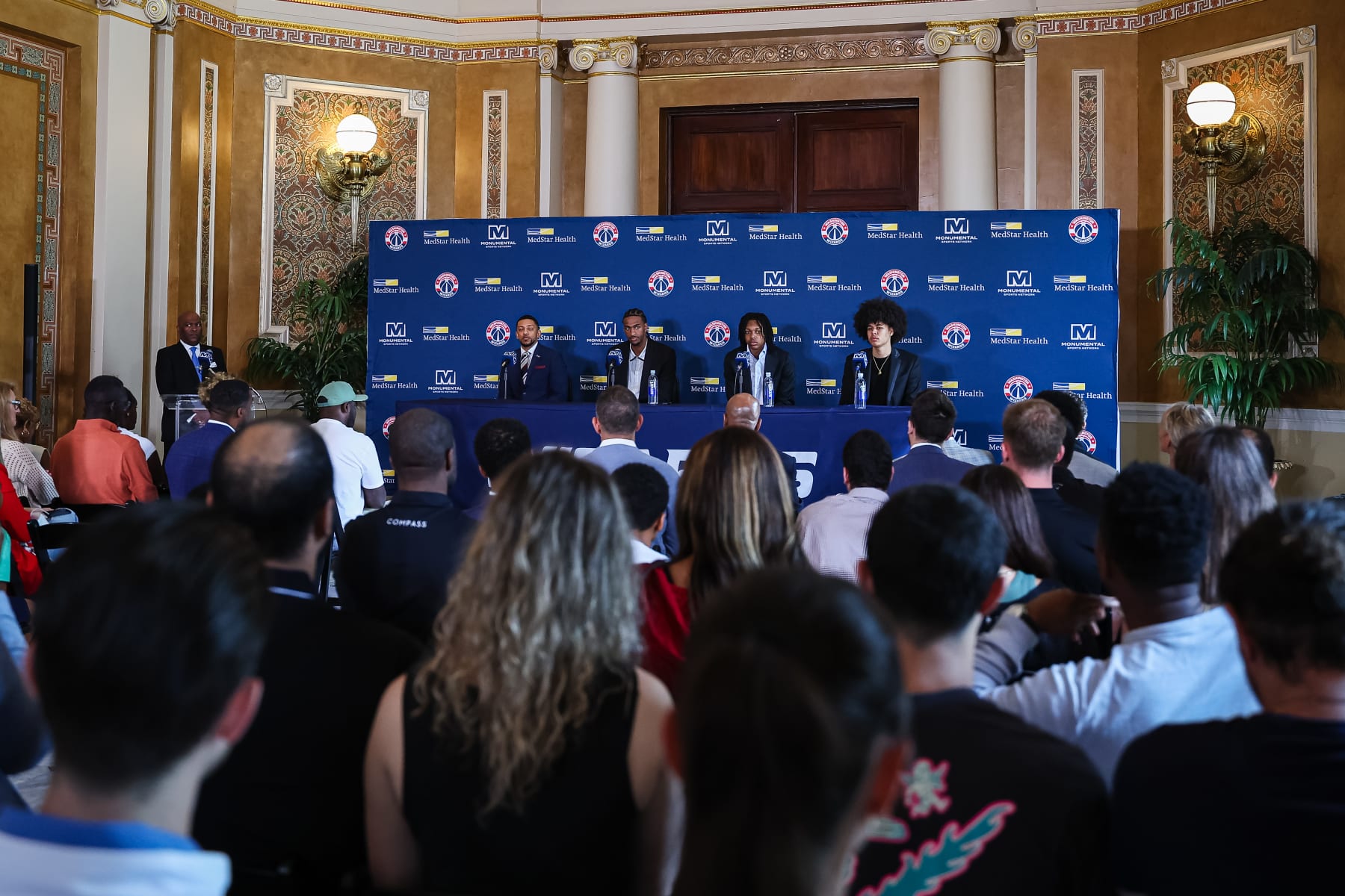 WASHINGTON, DC - JUNE 29: (L-R) General manager Will Dawkins, Alex Sarr #12, Bub Carrington #17, and Kyshawn George #18 of the Washington Wizards address the media as the Washington Wizards introduce their 2024 draft picks at Union Station on June 29, 2024 in Washington, DC. NOTE TO USER: User expressly acknowledges and agrees that, by downloading and or using this photograph, User is consenting to the terms and conditions of the Getty Images License Agreement. (Photo by Scott Taetsch/Getty Images)