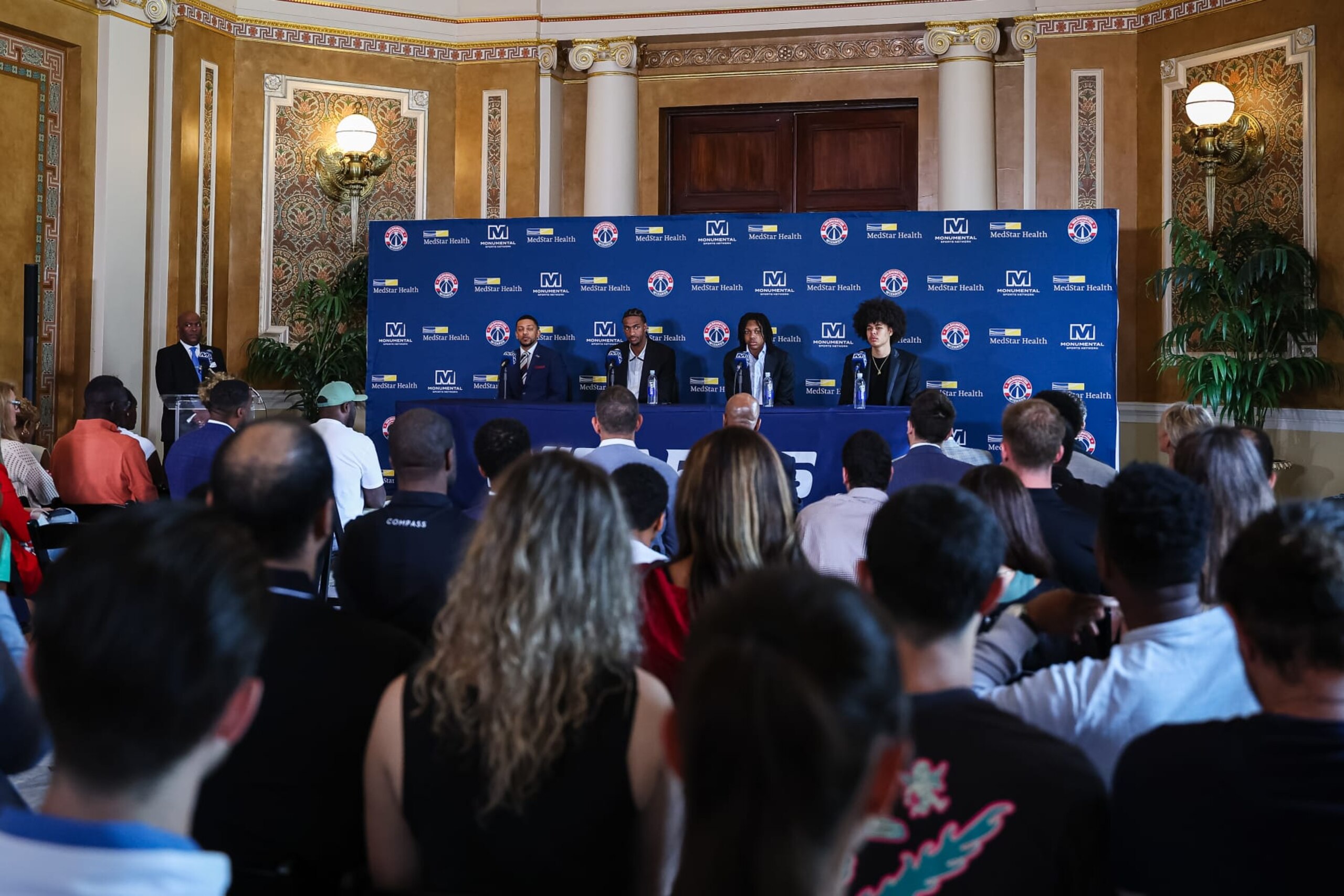 WASHINGTON, DC - JUNE 29: (L-R) General manager Will Dawkins, Alex Sarr #12, Bub Carrington #17, and Kyshawn George #18 of the Washington Wizards address the media as the Washington Wizards introduce their 2024 draft picks at Union Station on June 29, 2024 in Washington, DC. NOTE TO USER: User expressly acknowledges and agrees that, by downloading and or using this photograph, User is consenting to the terms and conditions of the Getty Images License Agreement. (Photo by Scott Taetsch/Getty Images) WASHINGTON, DC - JUNE 29: (L-R) General manager Will Dawkins, Alex Sarr #12, Bub Carrington #17, and Kyshawn George #18 of the Washington Wizards address the media as the Washington Wizards introduce their 2024 draft picks at Union Station on June 29, 2024 in Washington, DC. NOTE TO USER: User expressly acknowledges and agrees that, by downloading and or using this photograph, User is consenting to the terms and conditions of the Getty Images License Agreement. (Photo by Scott Taetsch/Getty Images)
