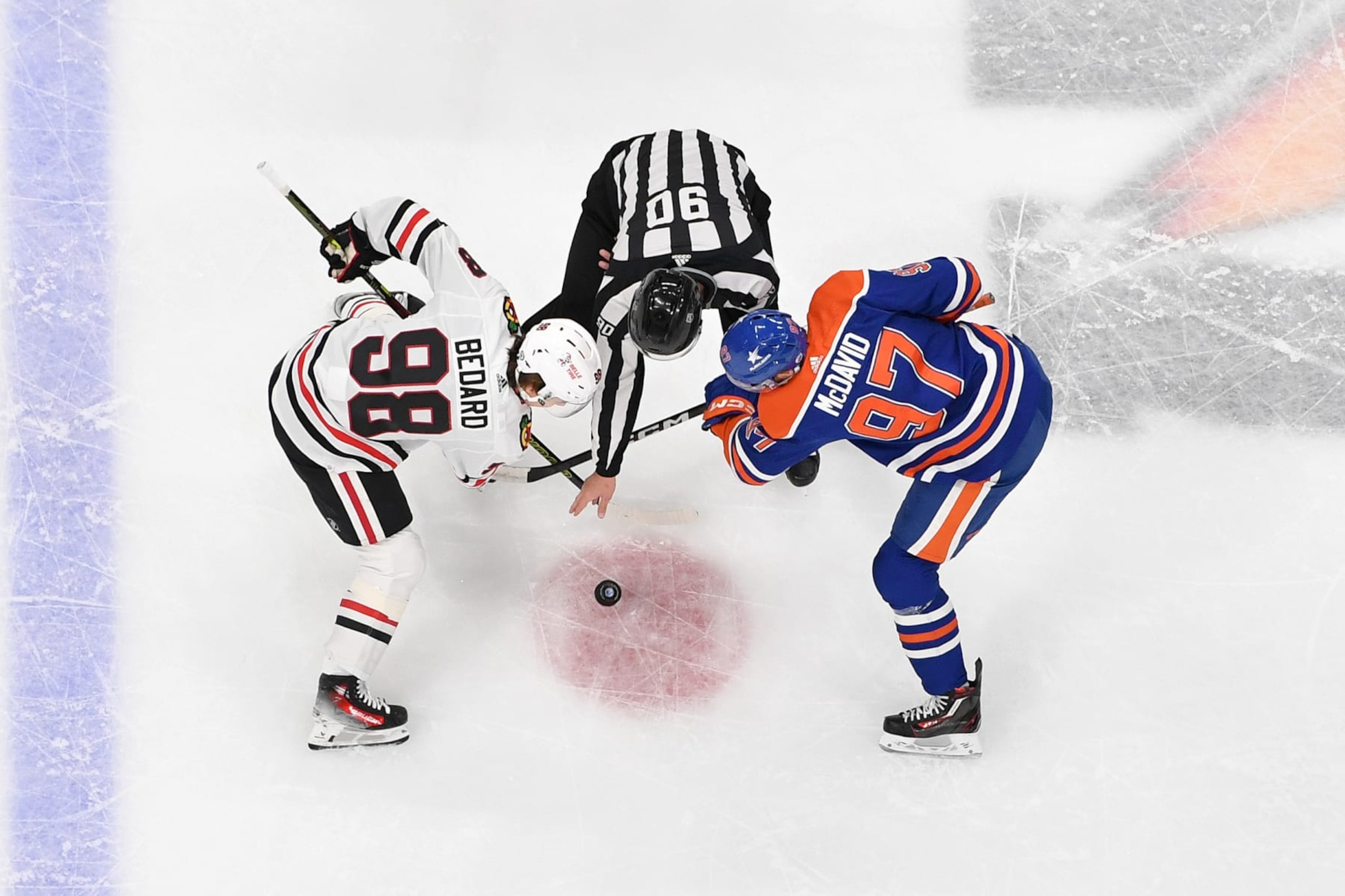 EDMONTON, CANADA - DECEMBER 12: Connor McDavid #97 of the Edmonton Oilers takes a face-off against Connor Bedard #98 of the Chicago Blackhawks during the game at Rogers Place on December 12, 2023, in Edmonton, Alberta, Canada. (Photo by Andy Devlin/NHLI via Getty Images) EDMONTON, CANADA - DECEMBER 12: Connor McDavid #97 of the Edmonton Oilers takes a face-off against Connor Bedard #98 of the Chicago Blackhawks during the game at Rogers Place on December 12, 2023, in Edmonton, Alberta, Canada. (Photo by Andy Devlin/NHLI via Getty Images)