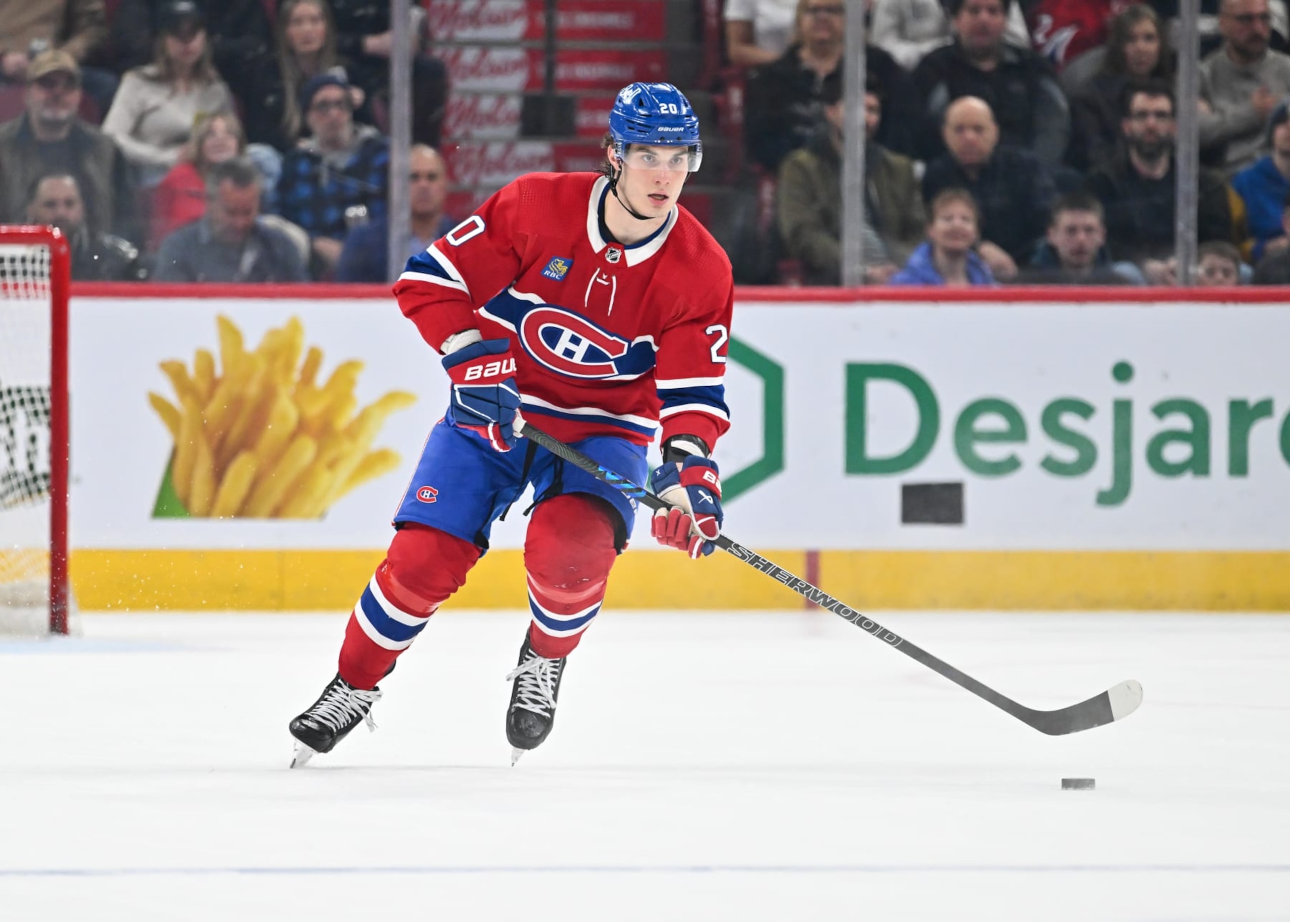 MONTREAL, CANADA - APRIL 06:  Juraj Slafkovsky #20 of the Montreal Canadiens skates the puck during the second period against the Toronto Maple Leafs at the Bell Centre on April 6, 2024 in Montreal, Quebec, Canada.  The Toronto Maple Leafs defeated the Montreal Canadiens 4-2.  (Photo by Minas Panagiotakis/Getty Images)