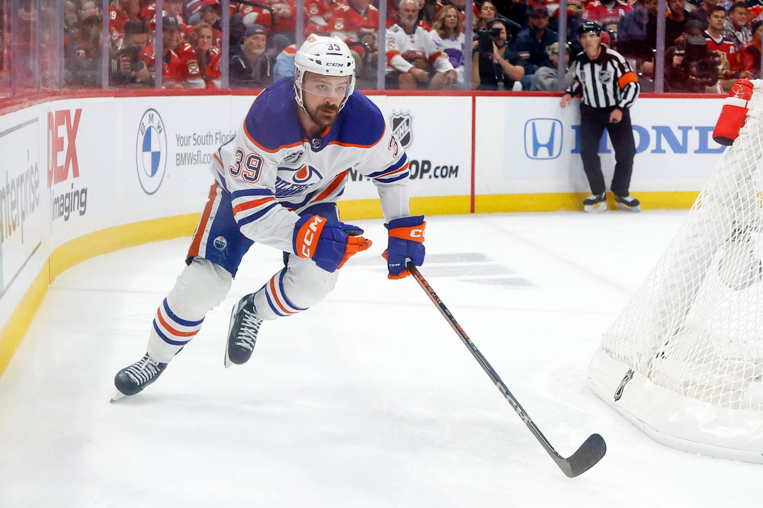 SUNRISE, FL - JUNE 10: Sam Carrick #39 of the Edmonton Oilers circles the Florida Panthers net in Game Two of the Final of the 2024 Stanley Cup Playoffs at the Amerant Bank Arena on June 10, 2024 in Sunrise, Florida. (Photo by Joel Auerbach/Getty Images)