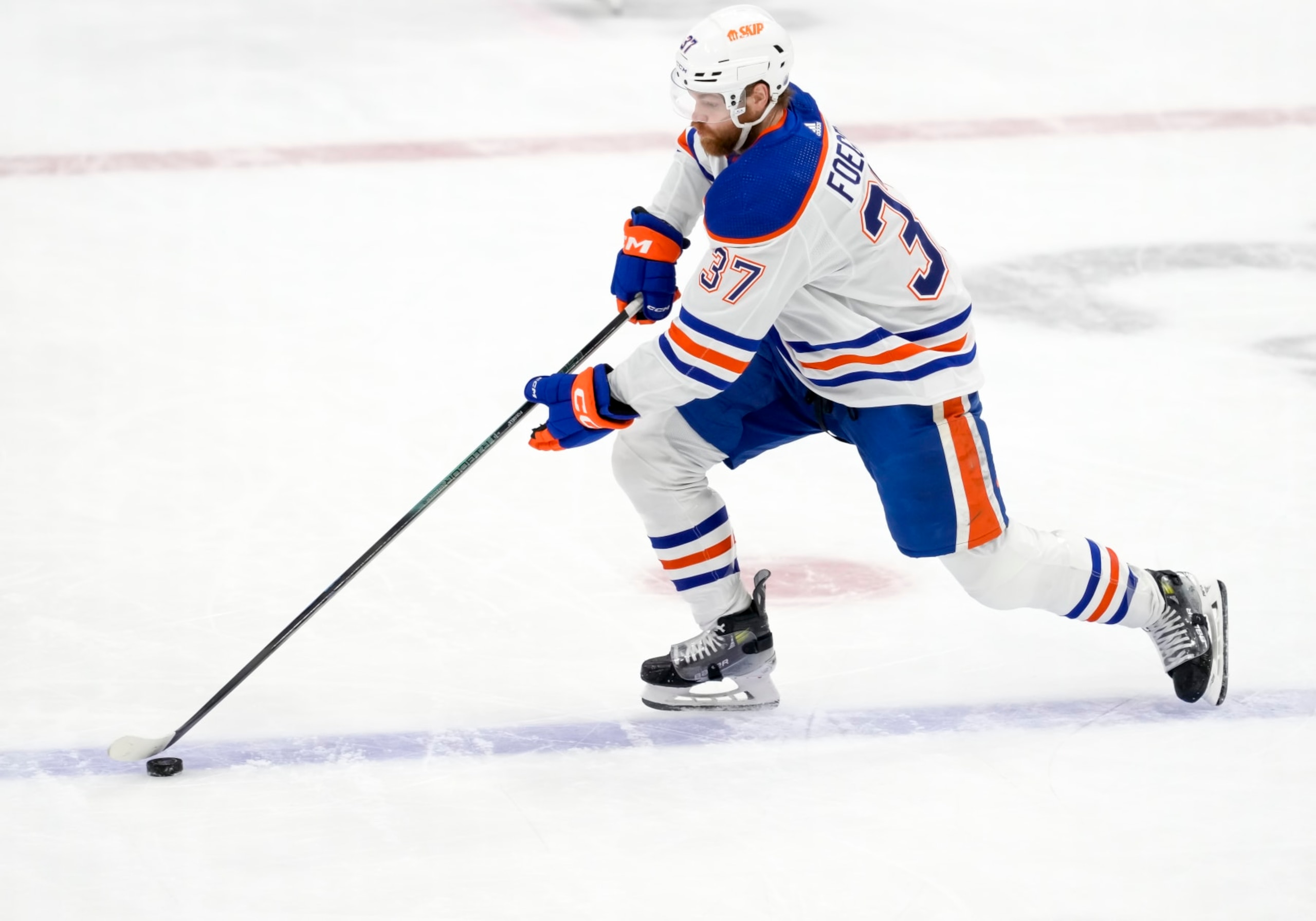 SUNRISE, FL - JUNE 24:  Edmonton Oilers left wing Warren Foegele (37) skates with the puck during the NHL Stanley Cup Finals, Game 7 between the Florida Panthers and Edmonton Oilers on June 24th, 2024 at Amerant Bank Arena in Sunrise, FL. (Photo by Andrew Bershaw/Icon Sportswire via Getty Images)