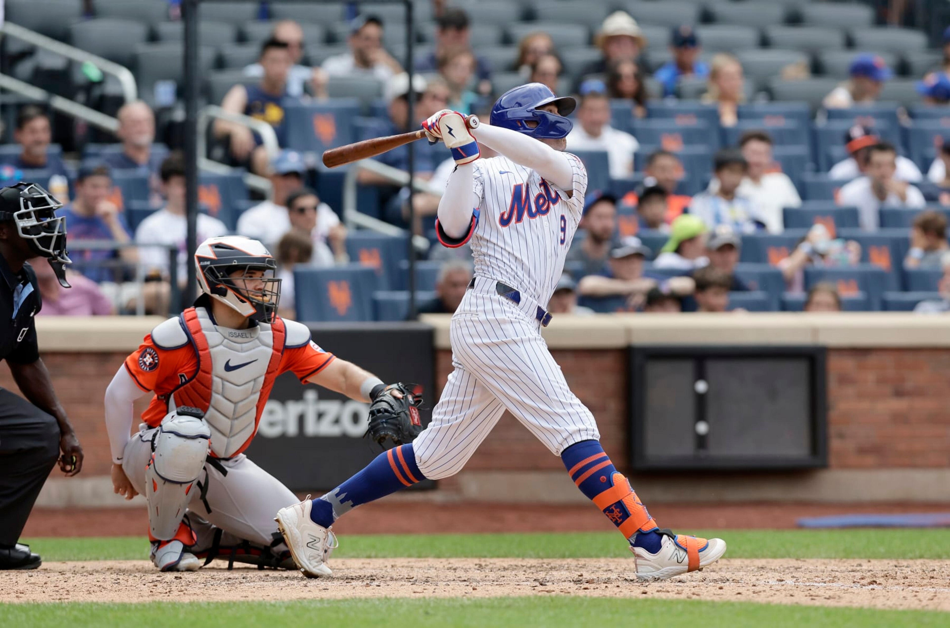 NEW YORK, NEW YORK - JUNE 30:  Brandon Nimmo #9 of the New York Mets follows through on his seventh inning two run home run against the Houston Astros at Citi Field on June 30, 2024 in New York City. (Photo by Jim McIsaac/Getty Images)