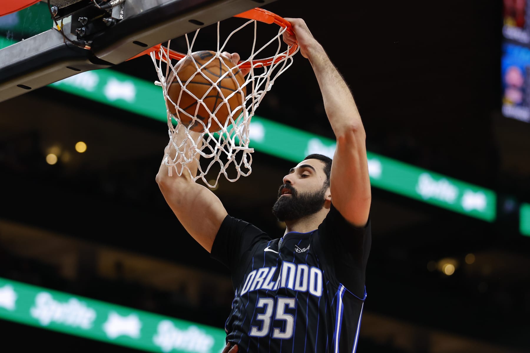 ATLANTA, GEORGIA - JANUARY 17: Goga Bitadze #35 of the Orlando Magic dunks during the first quarter against the Atlanta Hawks at State Farm Arena on January 17, 2024 in Atlanta, Georgia. NOTE TO USER: User expressly acknowledges and agrees that, by downloading and or using this photograph, User is consenting to the terms and conditions of the Getty Images License Agreement. (Photo by Todd Kirkland/Getty Images)