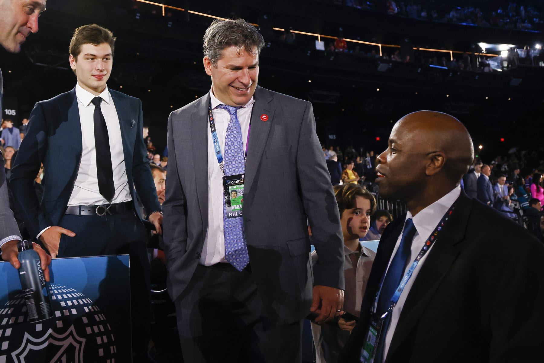 LAS VEGAS, NEVADA - JUNE 28: Macklin Celebrini, Scott Lachance and Mike Grier, from left, look on during the first round of the 2024 Upper Deck NHL Draft at Sphere on June 28, 2024 in Las Vegas, Nevada. (Photo by Bruce Bennett/Getty Images)
