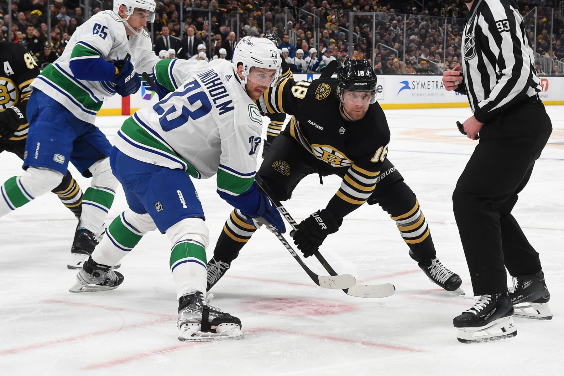 BOSTON, MASSACHUSETTS - FEBRUARY 8: Elias Lindholm #23 of the Vancouver Canucks faces off against Pavel Zacha #18 of the Boston Bruins at the TD Garden on February 8, 2024 in Boston, Massachusetts. (Photo by Steve Babineau/NHLI via Getty Images)