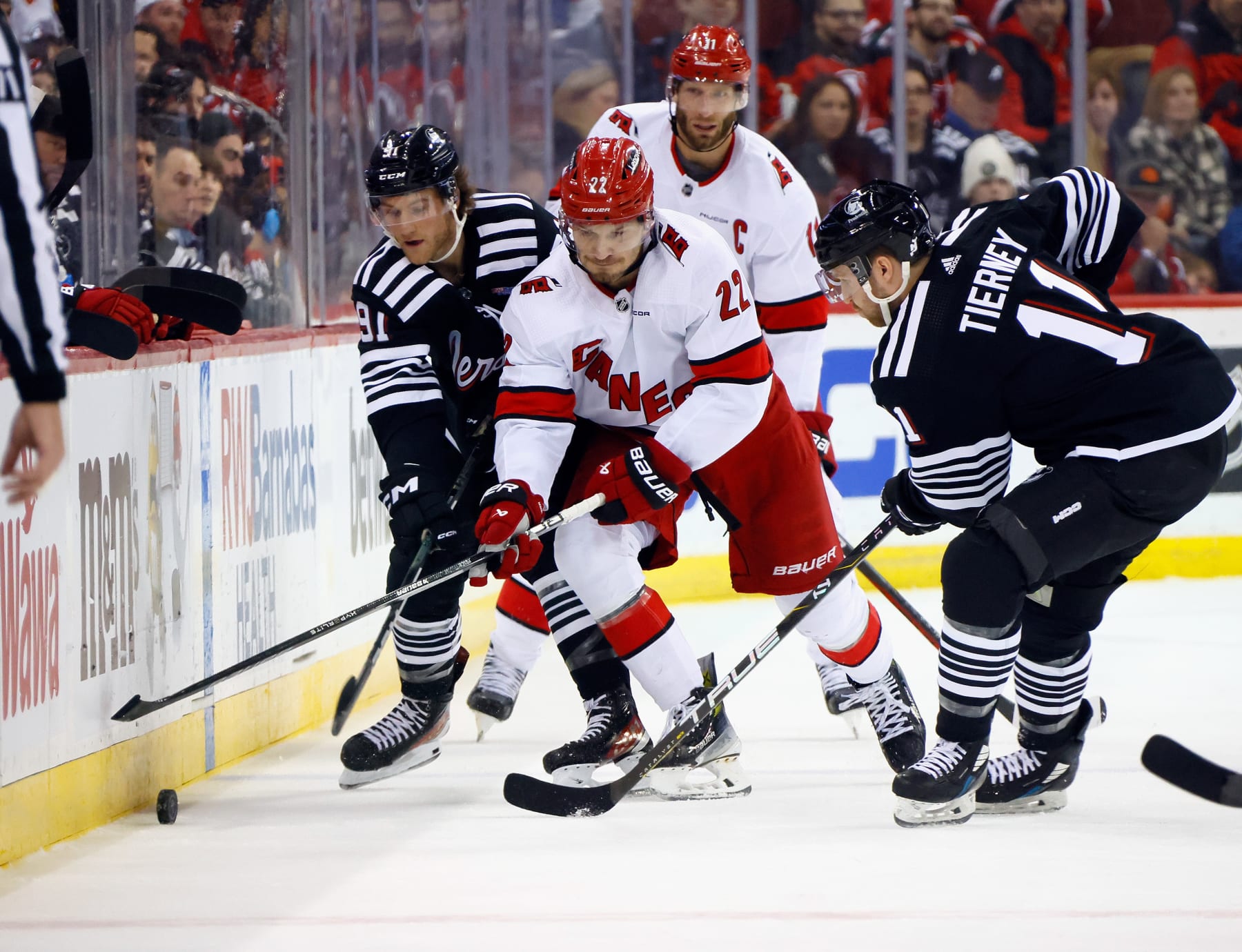 NEWARK, NEW JERSEY - MARCH 09: Brett Pesce #22 of the Carolina Hurricanes skates against the New Jersey Devils at Prudential Center on March 09, 2024 in Newark, New Jersey. (Photo by Bruce Bennett/Getty Images)