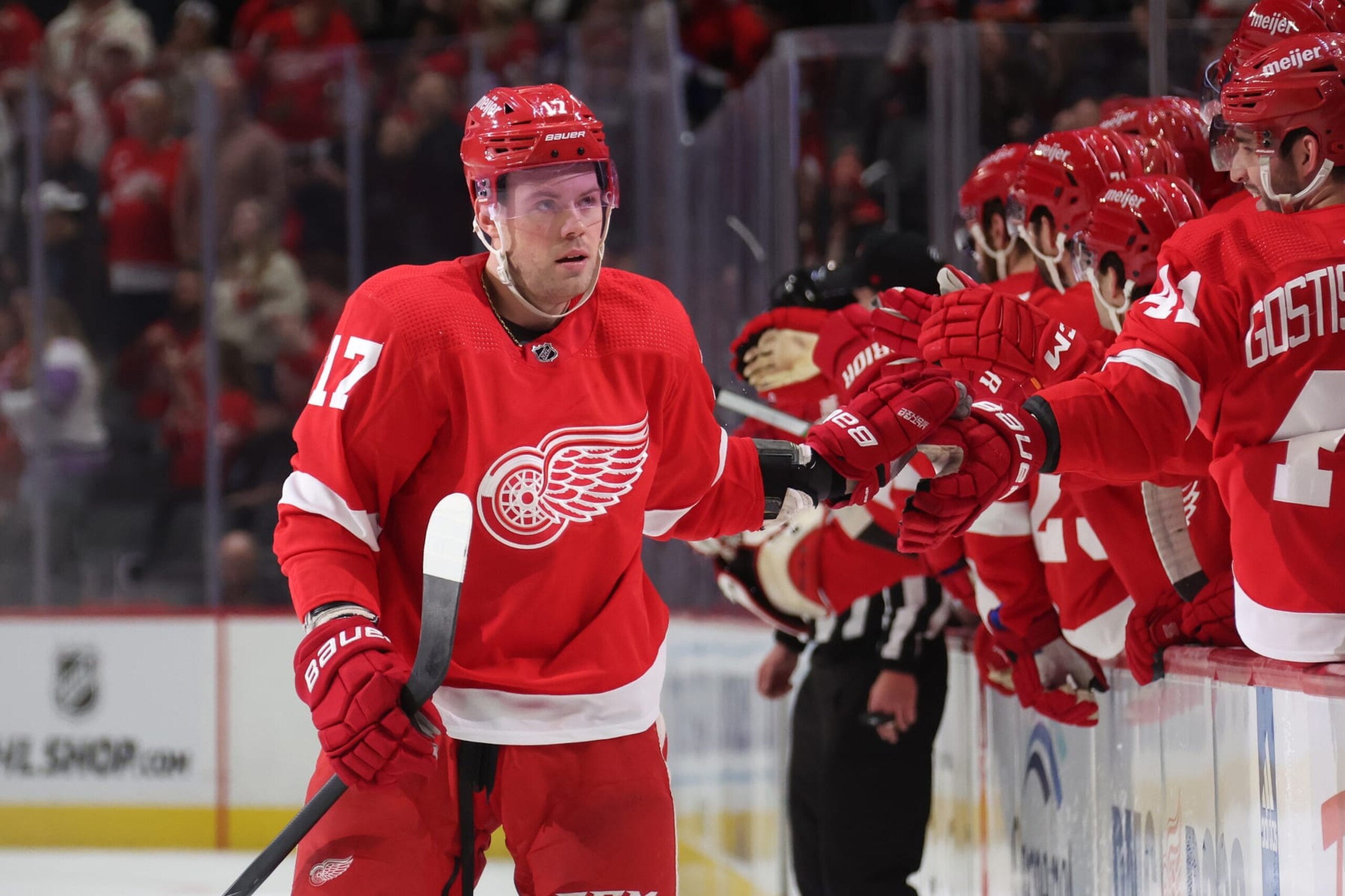 DETROIT, MICHIGAN - JANUARY 31: Daniel Sprong #17 of the Detroit Red Wings celebrates his first period goal with teammates while playing the Ottawa Senators at Little Caesars Arena on January 31, 2024 in Detroit, Michigan. (Photo by Gregory Shamus/Getty Images)