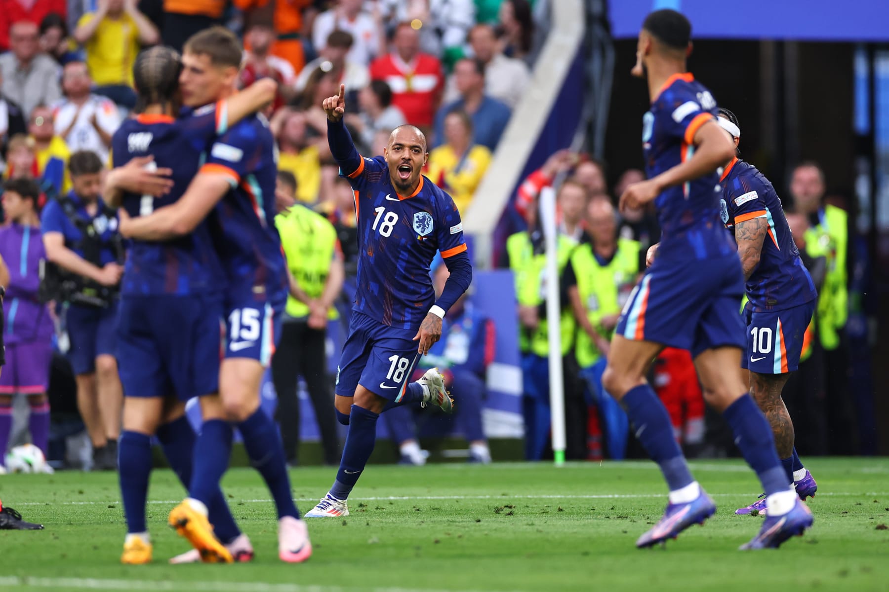 MUNICH, GERMANY - JULY 2: Donyell Malen of Netherlands celebrates after scoring a goal to make it 0-2 during the UEFA EURO 2024 round of 16 match between Romania and Netherlands at Munich Football Arena on July 2, 2024 in Munich, Germany. (Photo by Robbie Jay Barratt - AMA/Getty Images)