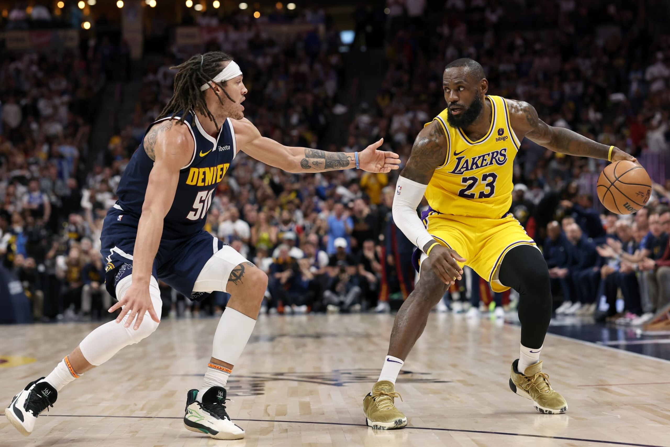 DENVER, COLORADO - APRIL 29: Aaron Gordon #50 of the Denver Nuggets guards LeBron James #23 of the Los Angeles Lakers in the third quarter during game five of the Western Conference First Round Playoffs at Ball Arena on April 29, 2024 in Denver, Colorado. NOTE TO USER: User expressly acknowledges and agrees that, by downloading and or using this photograph, User is consenting to the terms and conditions of the Getty Images License Agreement. (Photo by Matthew Stockman/Getty Images) DENVER, COLORADO - APRIL 29: Aaron Gordon #50 of the Denver Nuggets guards LeBron James #23 of the Los Angeles Lakers in the third quarter during game five of the Western Conference First Round Playoffs at Ball Arena on April 29, 2024 in Denver, Colorado. NOTE TO USER: User expressly acknowledges and agrees that, by downloading and or using this photograph, User is consenting to the terms and conditions of the Getty Images License Agreement. (Photo by Matthew Stockman/Getty Images)