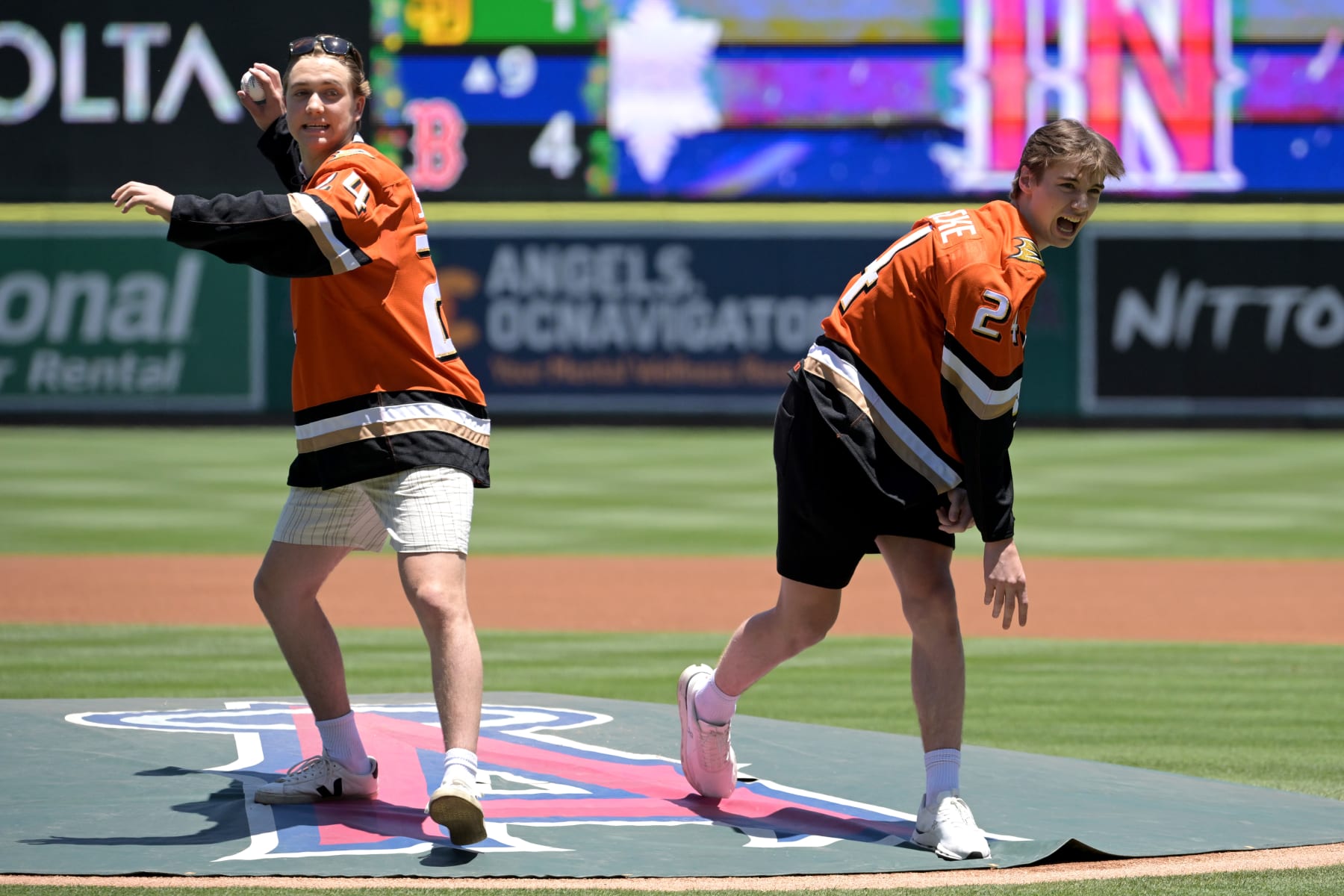 ANAHEIM, CALIFORNIA - JUNE 30: Anaheim Ducks first round draft picks Stian Solberg and Beckett Sennecke throw out the first pitch prior to the game between the Los Angeles Angels and the Detroit Tigers at Angel Stadium of Anaheim on June 30, 2024 in Anaheim, California. (Photo by Jayne Kamin-Oncea/Getty Images)
