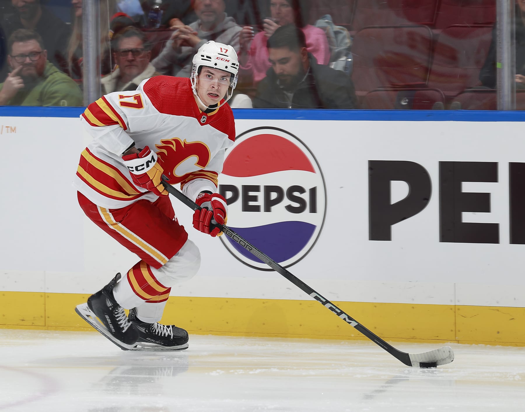 VANCOUVER, CANADA - APRIL 16: Yegor Sharangovich #17 of the Calgary Flames skates up ice during their NHL game against the Vancouver Canucks at Rogers Arena on April 16, 2024 in Vancouver, British Columbia, Canada.  (Photo by Jeff Vinnick/NHLI via Getty Images)