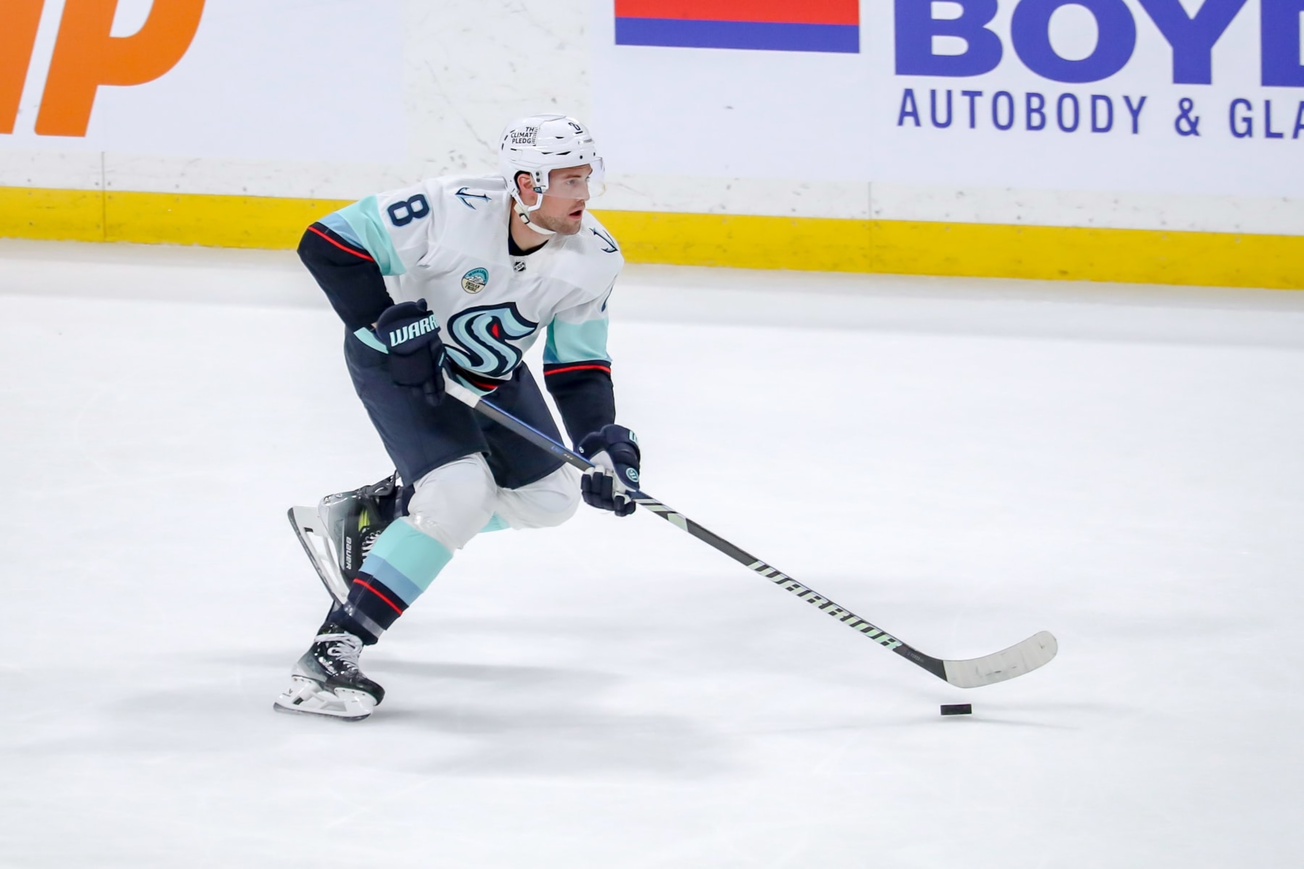 WINNIPEG, CANADA - APRIL 16: Brian Dumoulin #8 of the Seattle Kraken plays the puck down the ice during second period action against the Winnipeg Jets at the Canada Life Centre on April 16, 2024 in Winnipeg, Manitoba, Canada. The Jets defeated the Kraken 4-3. (Photo by Darcy Finley/NHLI via Getty Images)
