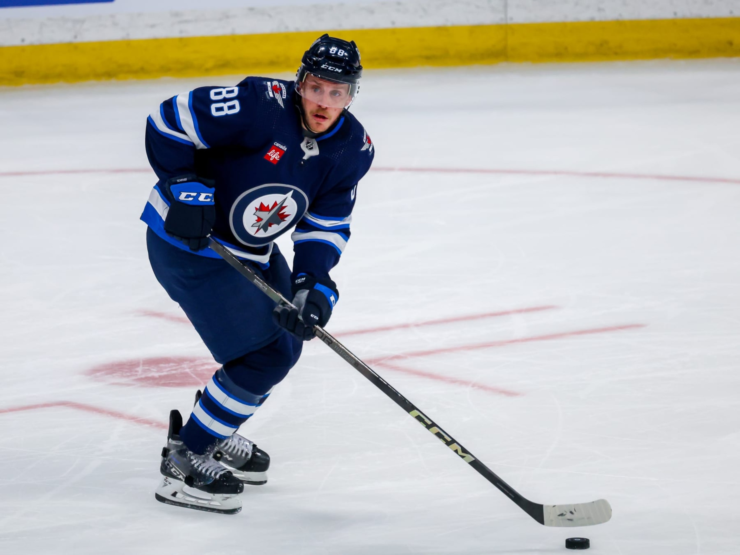 WINNIPEG, CANADA - APRIL 30: Nate Schmidt #88 of the Winnipeg Jets plays the puck during third period action against the Colorado Avalanche in Game Five of the First Round of the 2024 Stanley Cup Playoffs at Canada Life Centre on April 30, 2024 in Winnipeg, Manitoba, Canada. (Photo by Jonathan Kozub/NHLI via Getty Images)