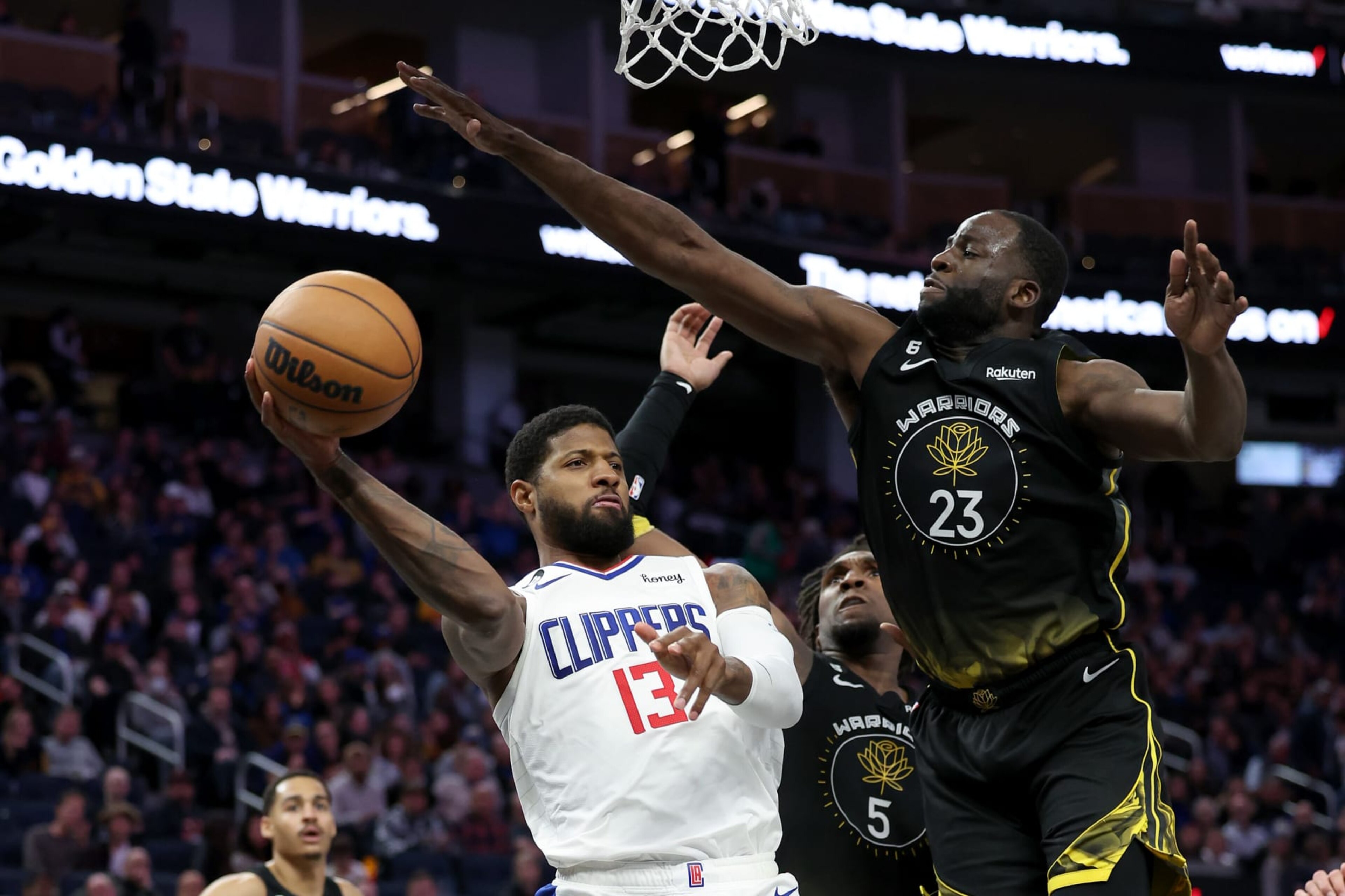 SAN FRANCISCO, CALIFORNIA - MARCH 02: Paul George #13 of the LA Clippers passes around Draymond Green #23 of the Golden State Warriors at Chase Center on March 02, 2023 in San Francisco, California. NOTE TO USER: User expressly acknowledges and agrees that, by downloading and or using this photograph, User is consenting to the terms and conditions of the Getty Images License Agreement. (Photo by Ezra Shaw/Getty Images) SAN FRANCISCO, CALIFORNIA - MARCH 02: Paul George #13 of the LA Clippers passes around Draymond Green #23 of the Golden State Warriors at Chase Center on March 02, 2023 in San Francisco, California. NOTE TO USER: User expressly acknowledges and agrees that, by downloading and or using this photograph, User is consenting to the terms and conditions of the Getty Images License Agreement. (Photo by Ezra Shaw/Getty Images)