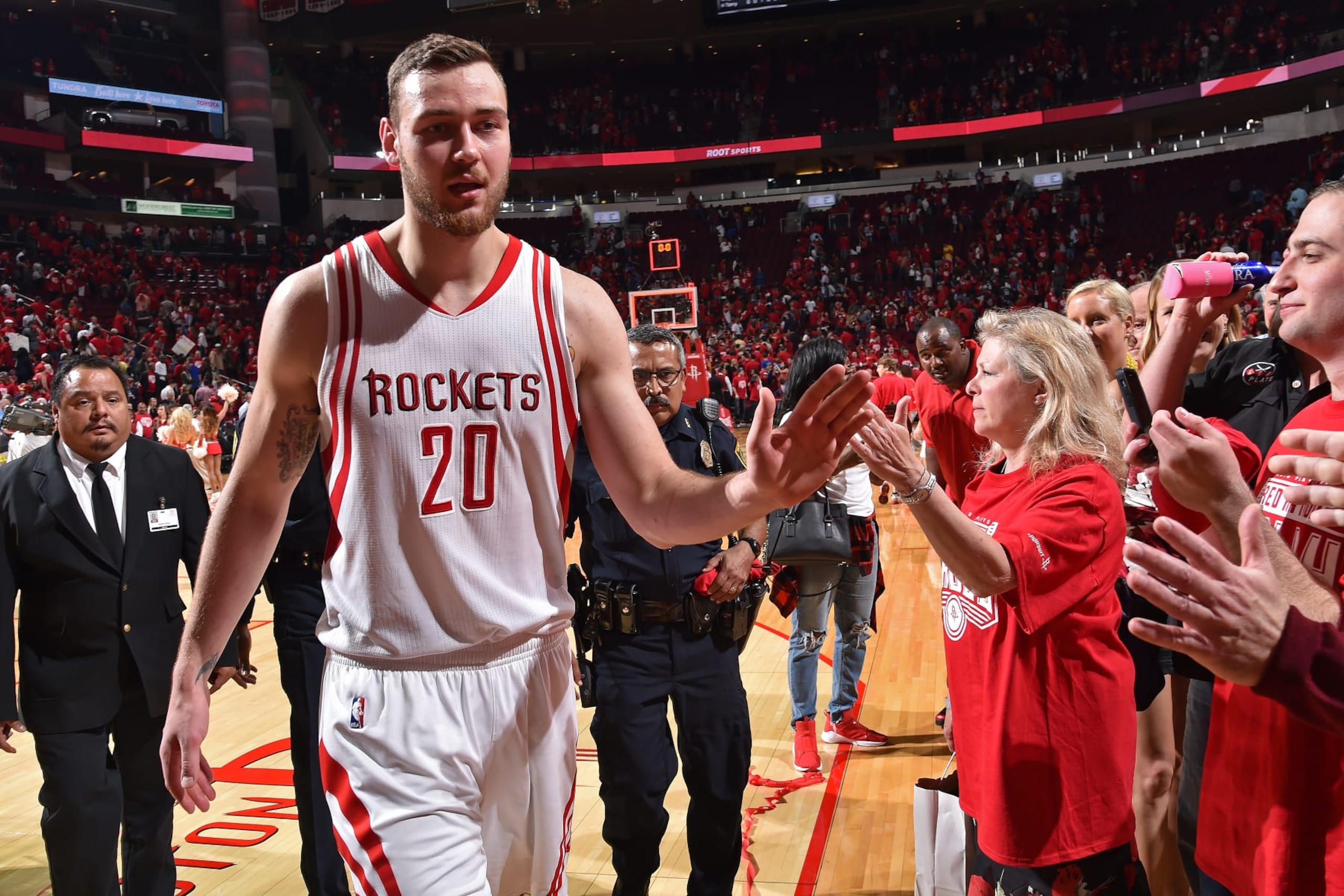 HOUSTON, TX - APRIL 21:  Donatas Motiejunas #20 of the Houston Rockets high fives fans after Game Three of the Western Conference Quarterfinals against the Golden State Warriors during the 2016 NBA Playoffs on April 21, 2016 at the Toyota Center in Houston, Texas. NOTE TO USER: User expressly acknowledges and agrees that, by downloading and or using this photograph, User is consenting to the terms and conditions of the Getty Images License Agreement. Mandatory Copyright Notice: Copyright 2016 NBAE (Photo by Bill Baptist/NBAE via Getty Images)