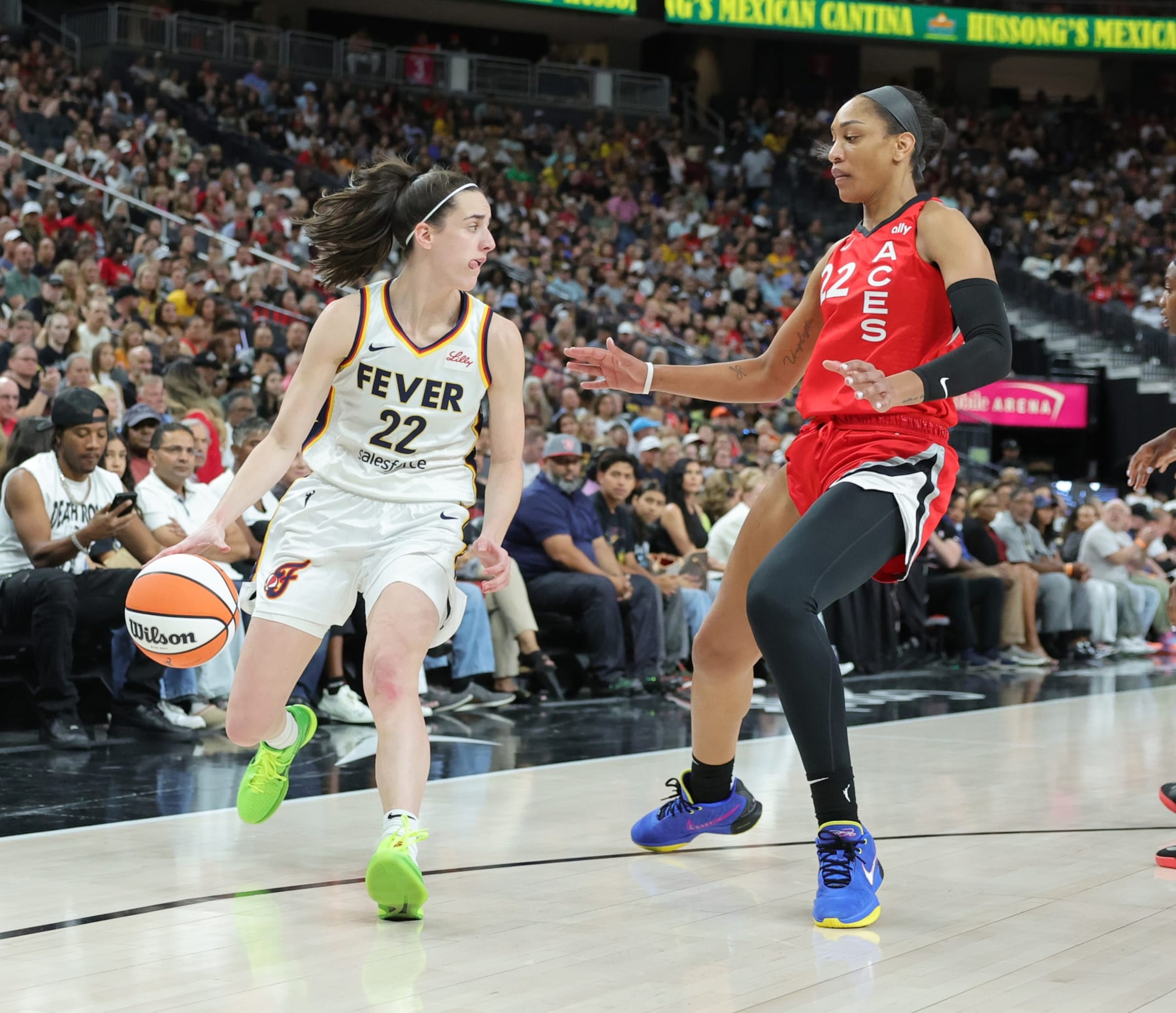 LAS VEGAS, NEVADA - JULY 02: Caitlin Clark #22 of the Indiana Fever is guarded by A'ja Wilson #22 of the Las Vegas Aces in the first quarter of their game at T-Mobile Arena on July 02, 2024 in Las Vegas, Nevada. NOTE TO USER: User expressly acknowledges and agrees that, by downloading and or using this photograph, User is consenting to the terms and conditions of the Getty Images License Agreement. (Photo by Ethan Miller/Getty Images)