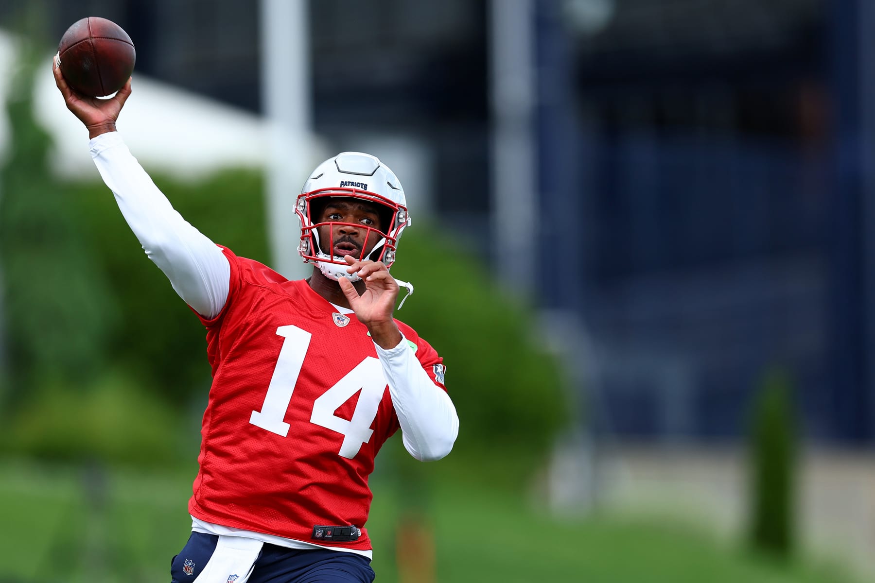 FOXBOROUGH, MASSACHUSETTS - MAY 29: Jacoby Brissett #14 of the New England Patriots makes a pass during the New England Patriots OTA Offseason Workout on May 29, 2024 in Foxborough, Massachusetts.  (Photo by Maddie Meyer/Getty Images)