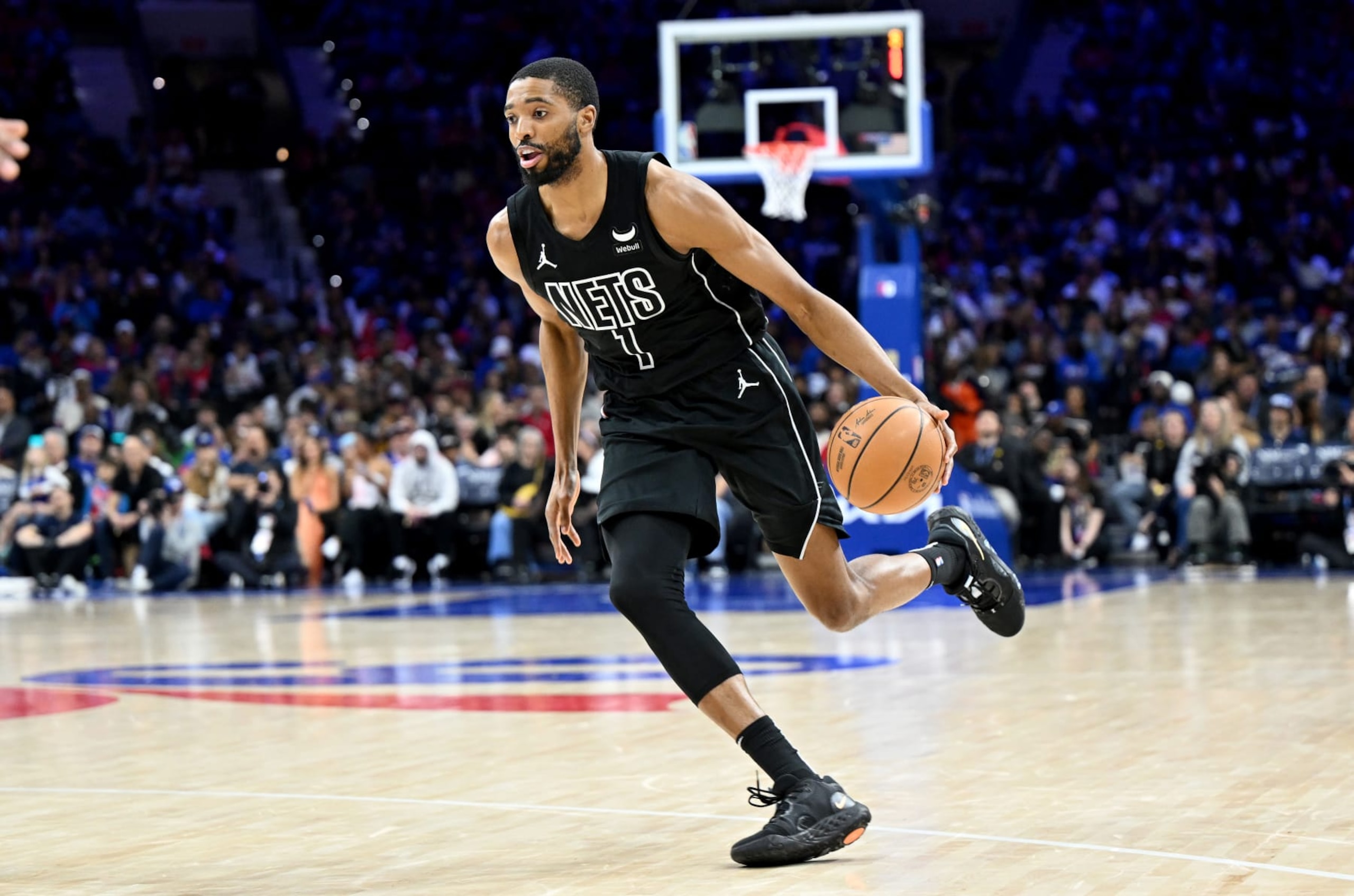 PHILADELPHIA, PENNSYLVANIA - APRIL 14: Mikal Bridges #1 of the Brooklyn Nets handles the ball against the Philadelphia 76ers at the Wells Fargo Center on April 14, 2024 in Philadelphia, Pennsylvania.  NOTE TO USER: User expressly acknowledges and agrees that, by downloading and or using this photograph, User is consenting to the terms and conditions of the Getty Images License Agreement. (Photo by G Fiume/Getty Images)