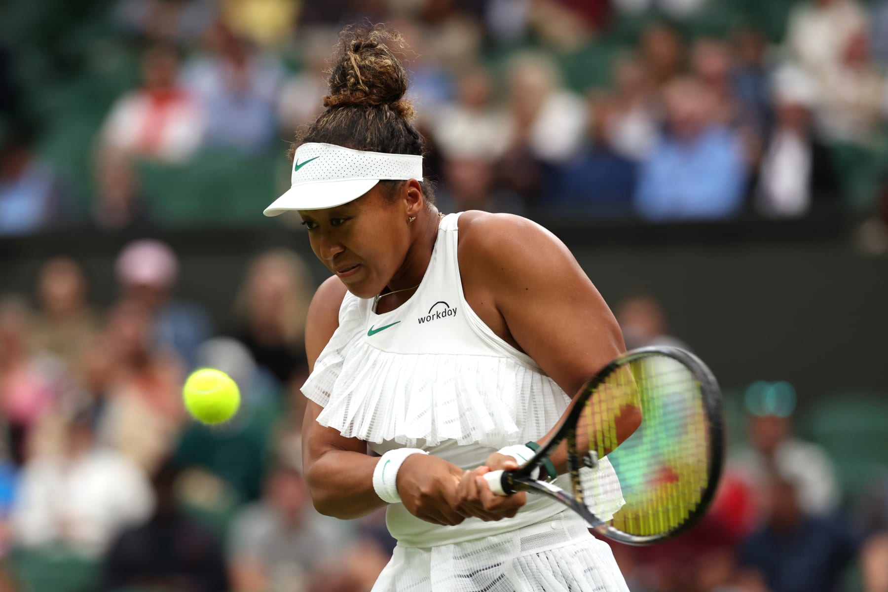 LONDON, ENGLAND - JULY 03: Naomi Osaka of Japan plays a backhand against Emma Navarro of United States in her in the Women's Singles second round match during day three of The Championships Wimbledon 2024 at All England Lawn Tennis and Croquet Club on July 03, 2024 in London, England. (Photo by Sean M. Haffey/Getty Images)