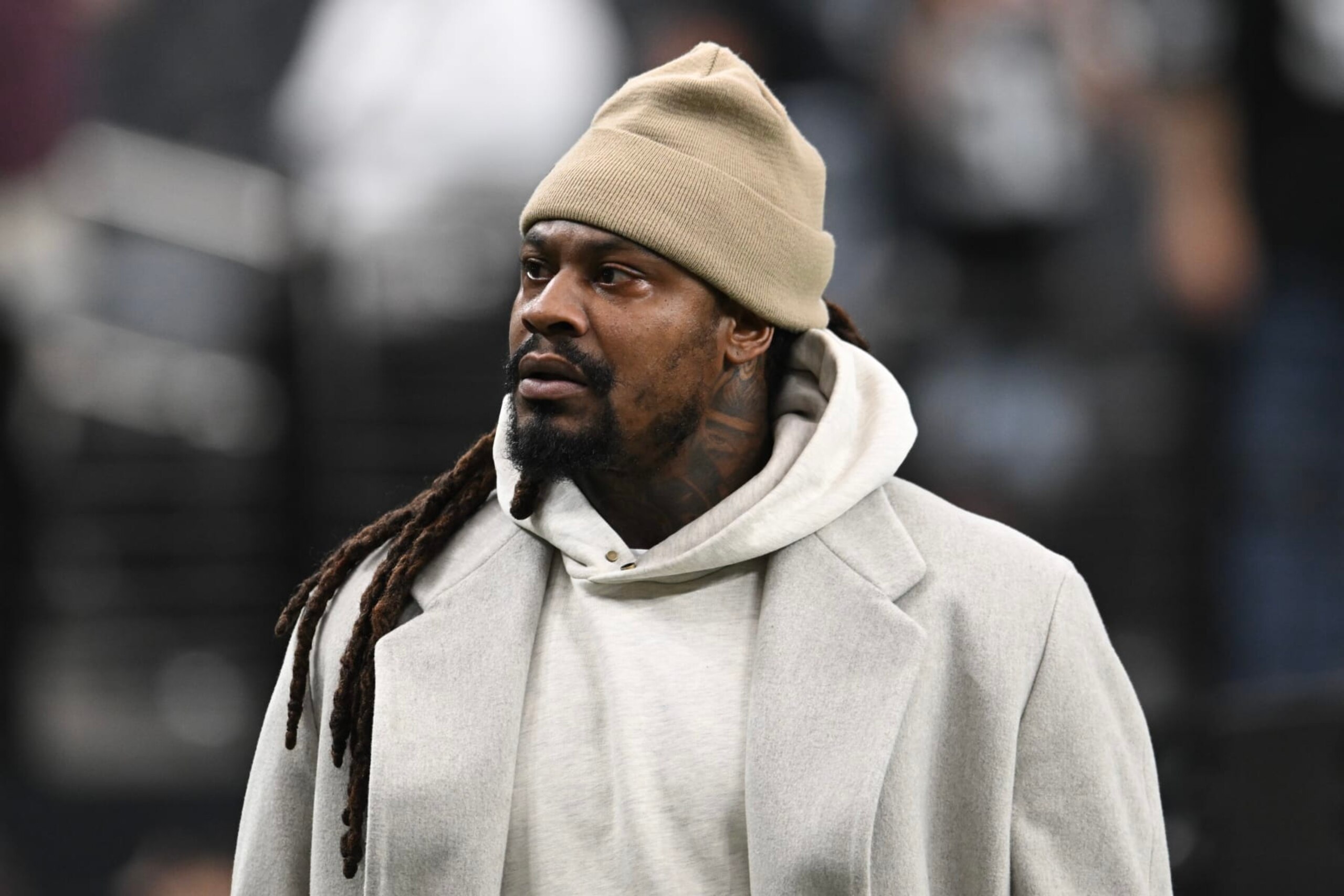 LAS VEGAS, NEVADA - OCTOBER 09: Former NFL player Marshawn Lynch walks the sideline before the Las Vegas Raiders and Green Bay Packers game at Allegiant Stadium on October 09, 2023 in Las Vegas, Nevada. The Raiders defeated the Packers 17-13. (Photo by Candice Ward/Getty Images)