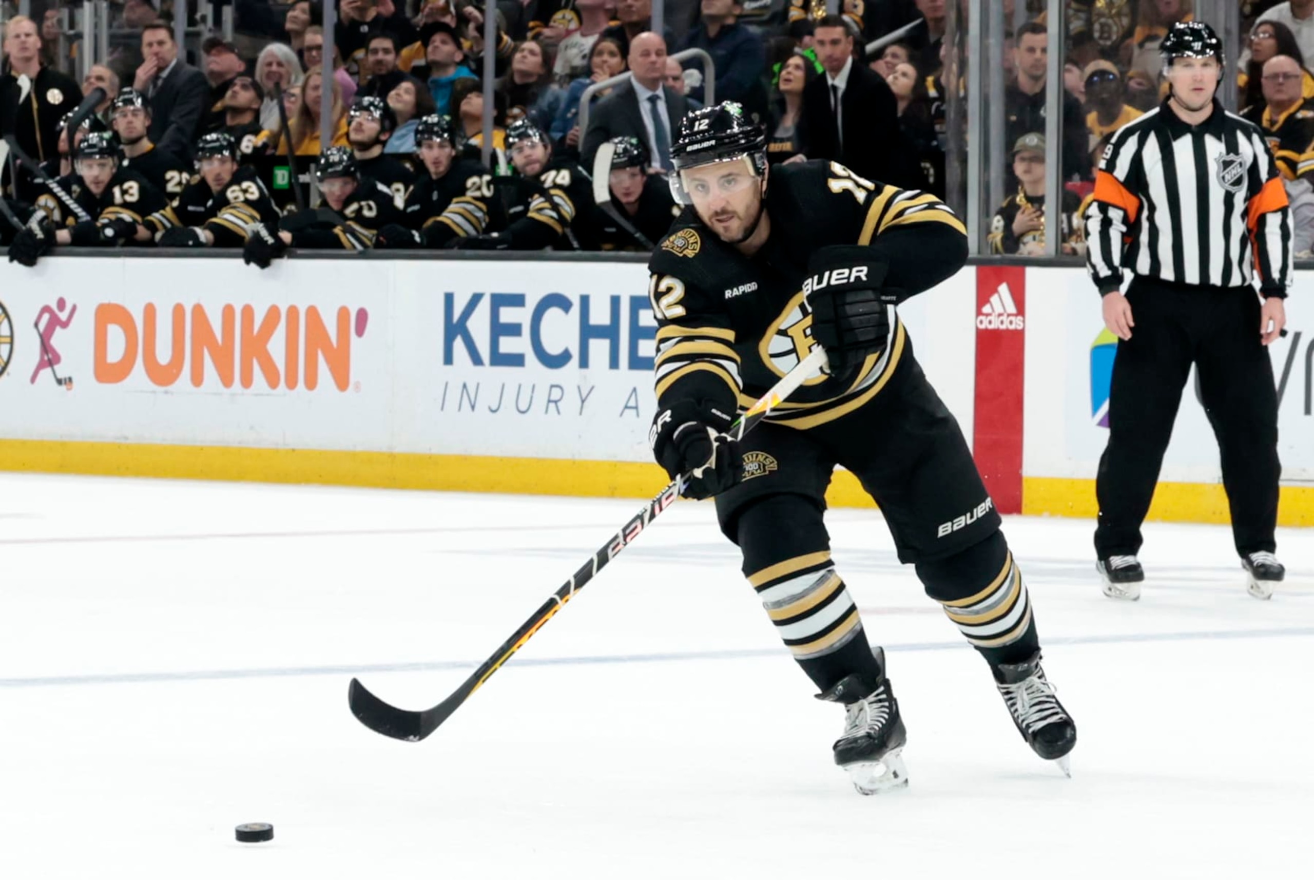 BOSTON, MA - APRIL 16: Boston Bruins defenseman Kevin Shattenkirk (12) passes the puck on the power play during a game between the Boston Bruins and the Ottawa Senators on April 16, 2024, at TD Garden in Boston, Massachusetts. (Photo by Fred Kfoury III/Icon Sportswire via Getty Images)