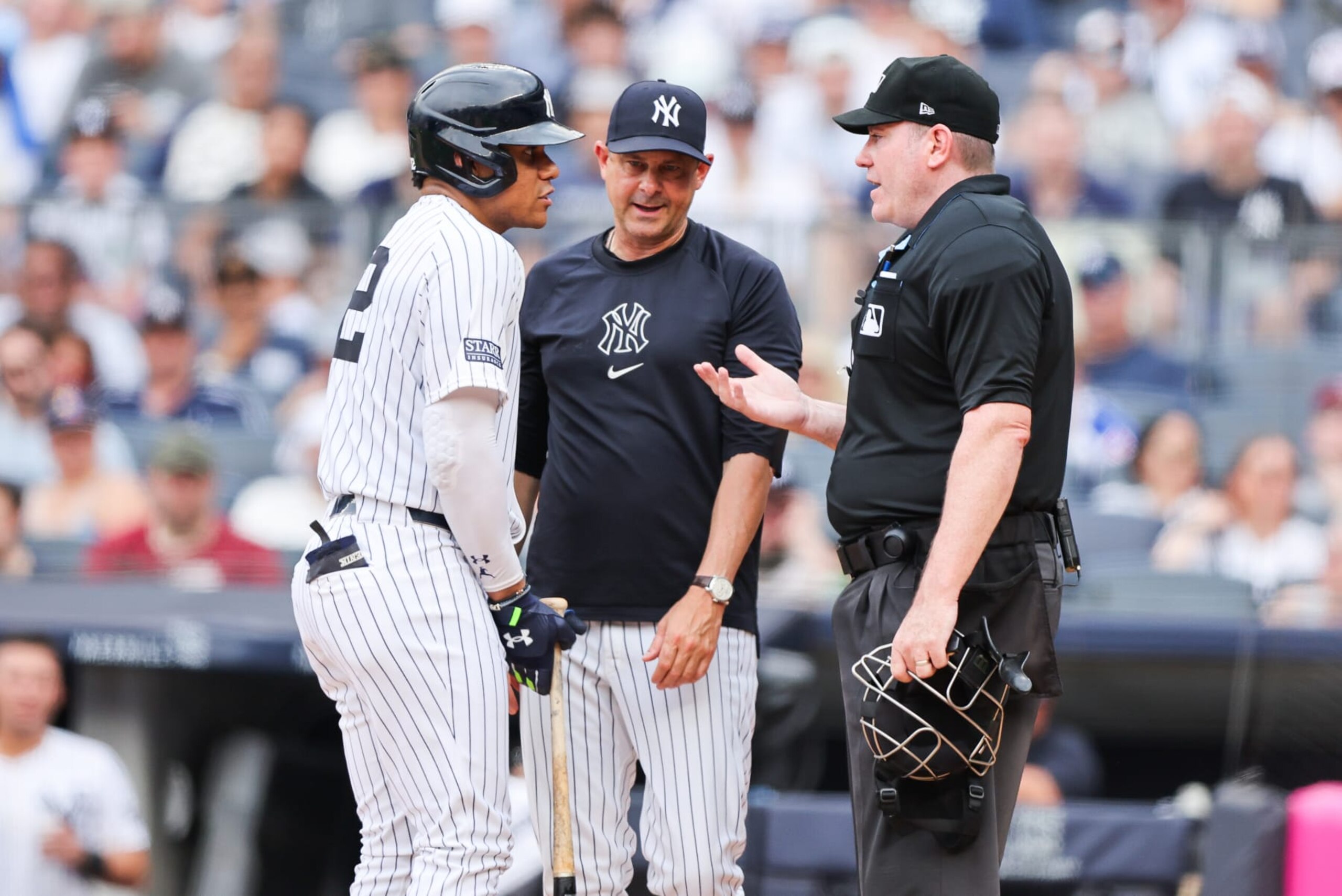 BRONX, NY - JUNE 23: New York Yankees manager Aaron Boone gets in between the home plate umpire and New York Yankees outfielder Juan Soto (22) after striking out during a game between the Atlanta Braves and the New York Yankees on June 23, 2024 at Yankee Stadium in the Bronx, New York.
(Photo by Andrew Mordzynski/Icon Sportswire via Getty Images)